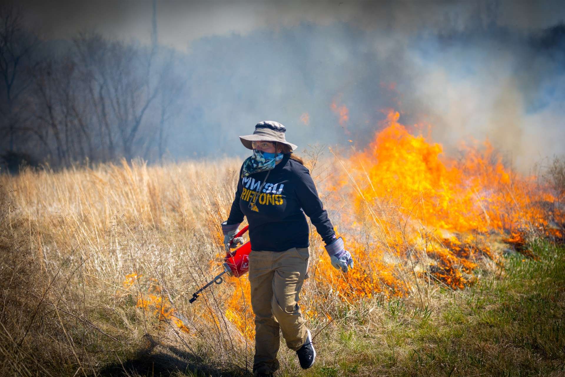 A MoWest student participates in a prescribed burn of the John Rushin Teaching and Research Prairie on April 1, 2023/ Photo courtesy of MoWest Communications