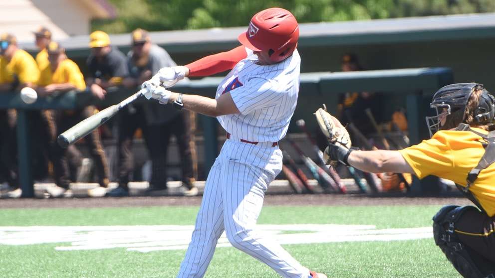 Diesel Purnell hits a two-run home run in Game 1 of the No. 23-ranked Blue Dragons' 8-0 win over Garden City on Saturday at Hobart-Detter Field. (Samantha Carpenter/Blue Dragon Sports Information)