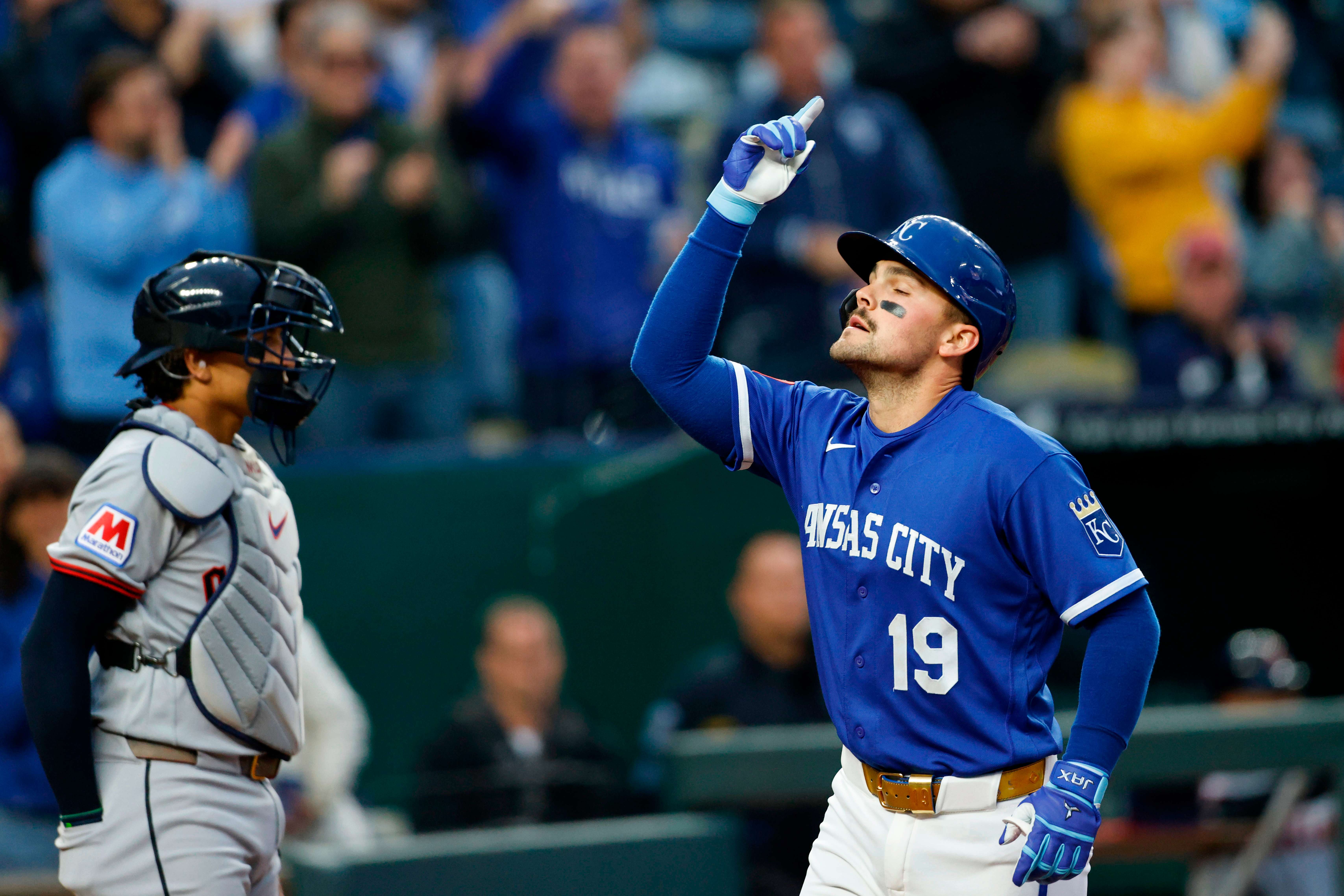 Kansas City Royals' Michael Massey, reacts as he celebrates his two-run home run as he crosses home plate near Cleveland Guardians catcher Bo Naylor, left, during the fourth inning of a baseball game against the Cleveland Guardians in Kansas City, Mo., Tuesday, May 5, 2026. (AP Photo/Colin E. Braley)