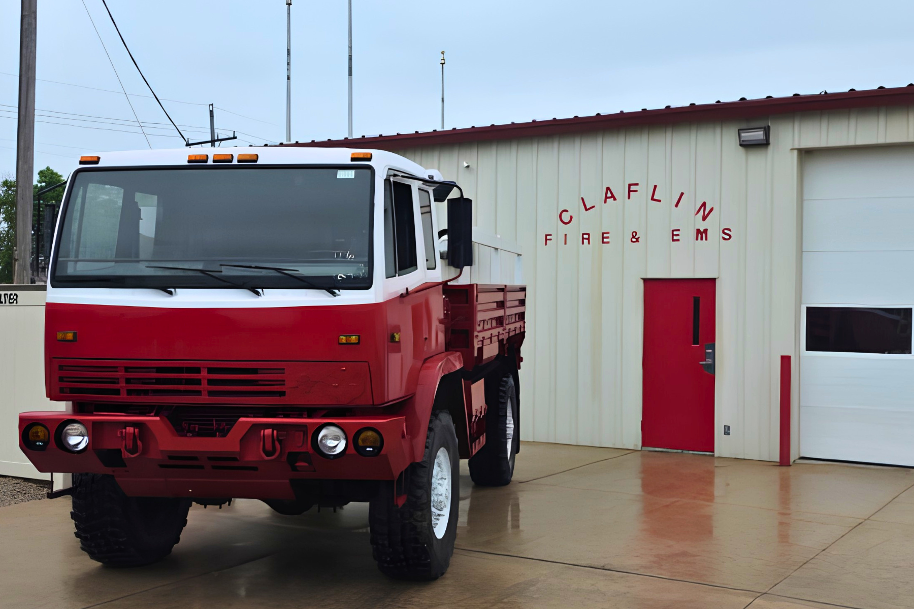 Fire District No. 1’s newly purchased Stewart and Stevenson fire truck pictured in front of the  Claflin Fire Department.