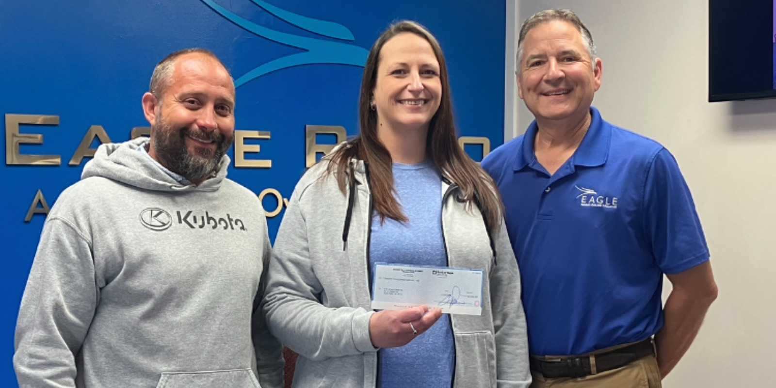 Representatives from the D &amp; N Events Center accept a check for $20,000 from Eagle Media and the Schmidt Foundation for new bleachers as part of the North Platte Giving Day efforts. (North Platte Post)