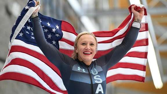 Olympic bobsled athlete Kaillie Humphries waving the American flag. Courtesy photo&nbsp;