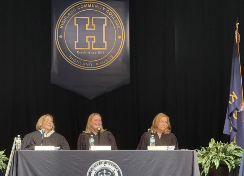 ks supreme court Chief Judge Sarah Warner (center) with Judges Karen Arnold-Burger (left) and Laura Johnson-Mcnish (right) preside over a travel docket hearing at Highland Community College.&nbsp;Photo by Zach Boblitt/Kansas Public Radio-Kansas News Service