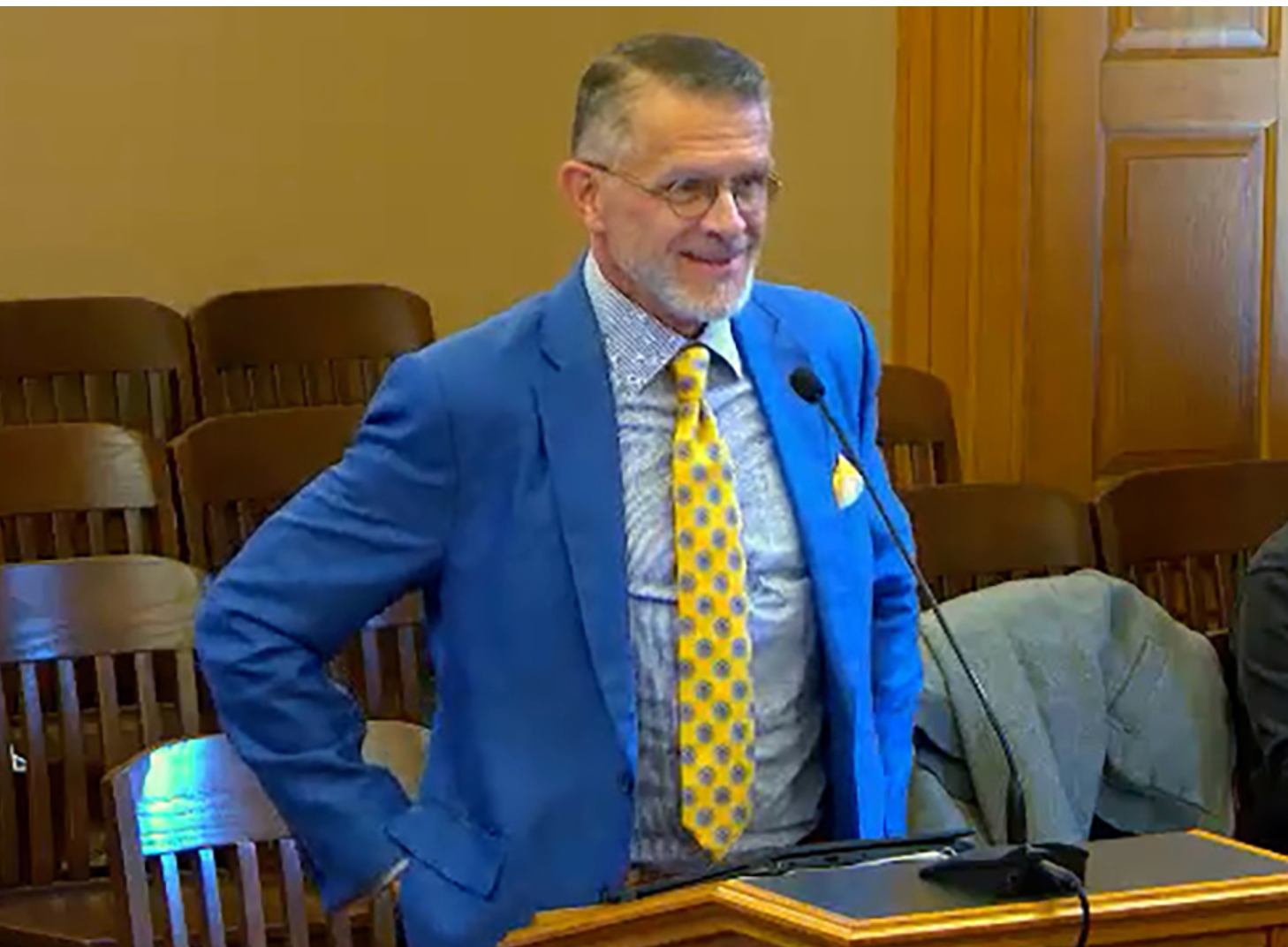  Brad Heppner, former chairman of Beneficient and bankrupt GWG Holdings, is guilty of federal fraud counts for illegally funneling more than $150 million in company funds to a trust he secretly controlled. At Heppner's request, the Kansas Legislature granted a bank charter to a Beneficient subsidiary. This is a 2025 image of Heppner testifying before the Legislature. (Kansas Reflector screen capture from Kansas Legislature video)