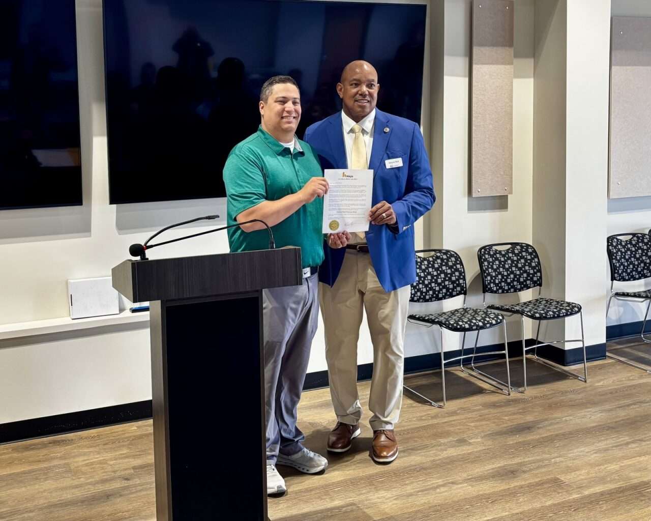 Mayor Mason Ruder and&nbsp;Small Business Administration district director Wayne Bell holding a signed proclamation declaring May 3 to 9, 2026, as National Small Business Week in Hays. Photo by Tony Guerrero/Hays Post