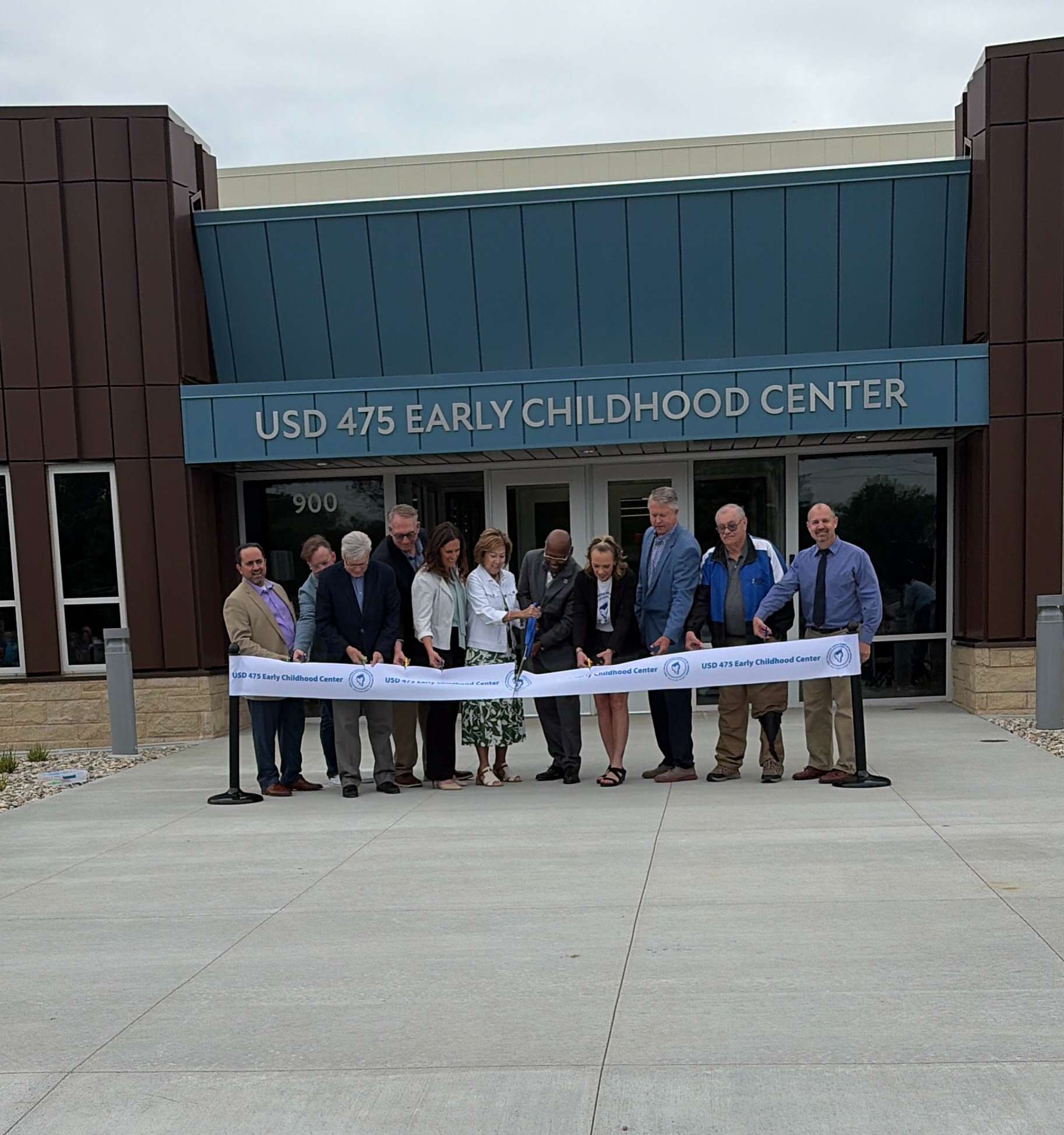 USD 475 Board of Education Members along with Superintendent of Schools Dr. Reginald Eggleston, Early Childhood Center staff, and Kansas U.S. Senator Roger Marshall cut the ribbon to officially open the brand new Early Childhood Center at 900 N. Eisenhower in Junction City.&nbsp;