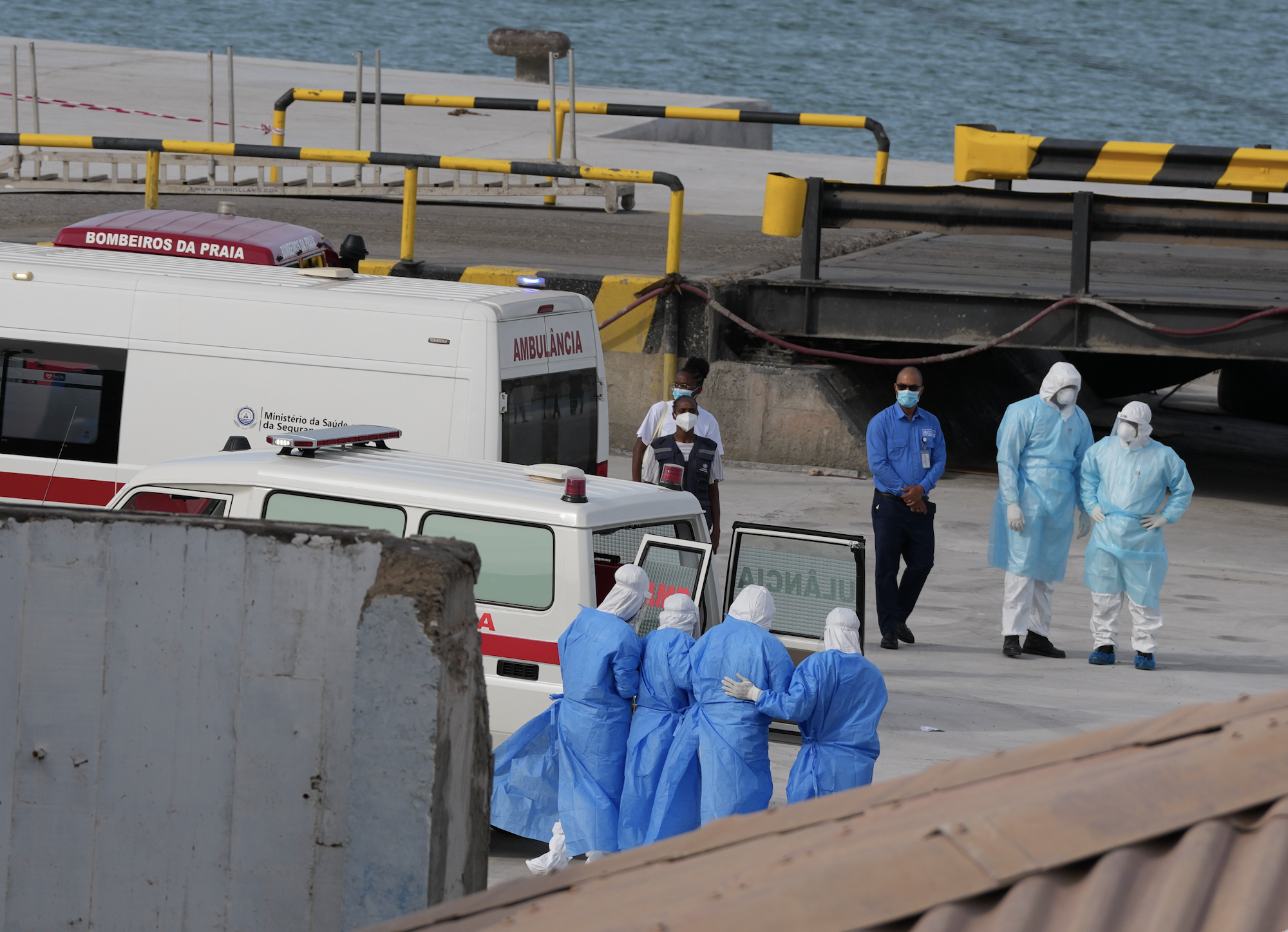 Health workers in protective gear evacuate patients from the MV Hondius cruise ship at a port in Praia, Cape Verde, Wednesday, May 6, 2026. (AP Photo/Misper Apawu)