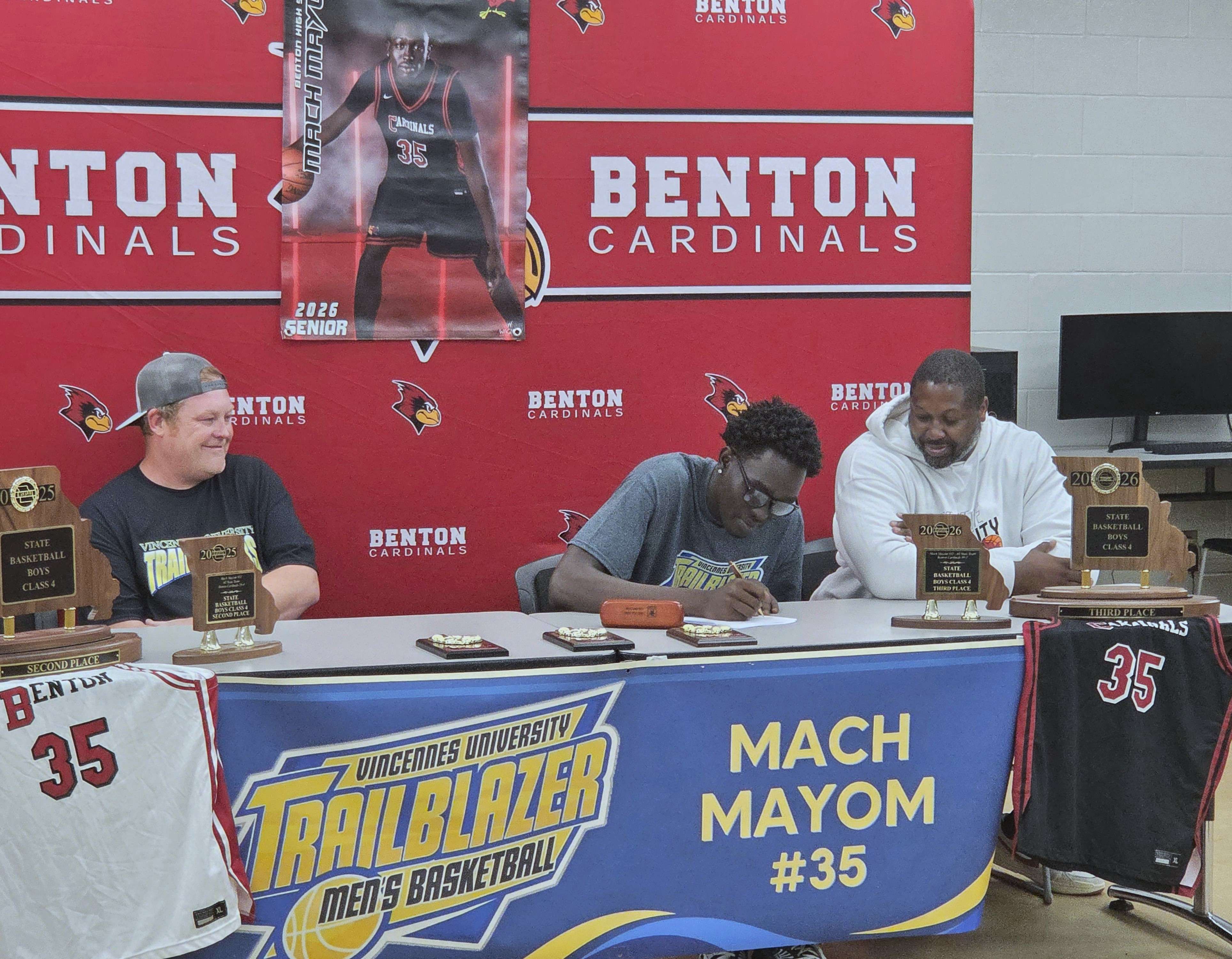 Mach Mayom signs his National Letter of Intent to play basketball at Vincennes University next season/ Photo by Matt Pike