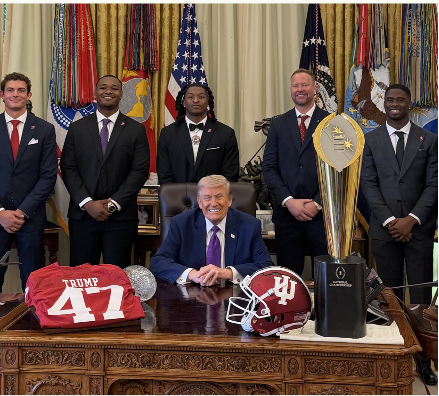 File image- President Trump with members of the University of Indiana national champion football team in the Oval Office Monday- image courtesy White Hous