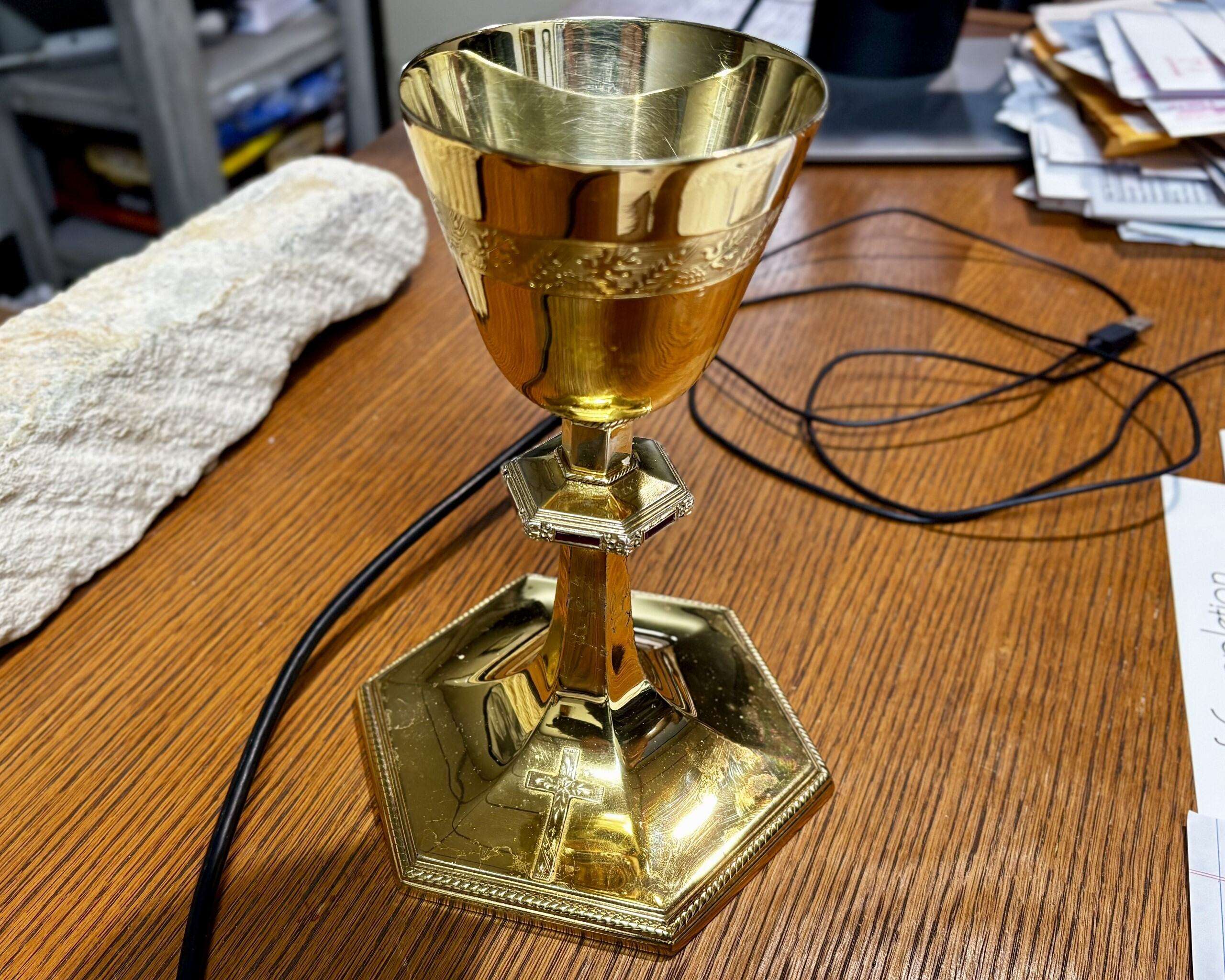 The Rev. Andy Hammeke's chalice, once belonging to his great-uncle, Father Gerald Hammeke. The wedding ring of Gerald's mother was melted down to form the cross on the base of the chalice. Photo by Tony Guerrero/Hays Post