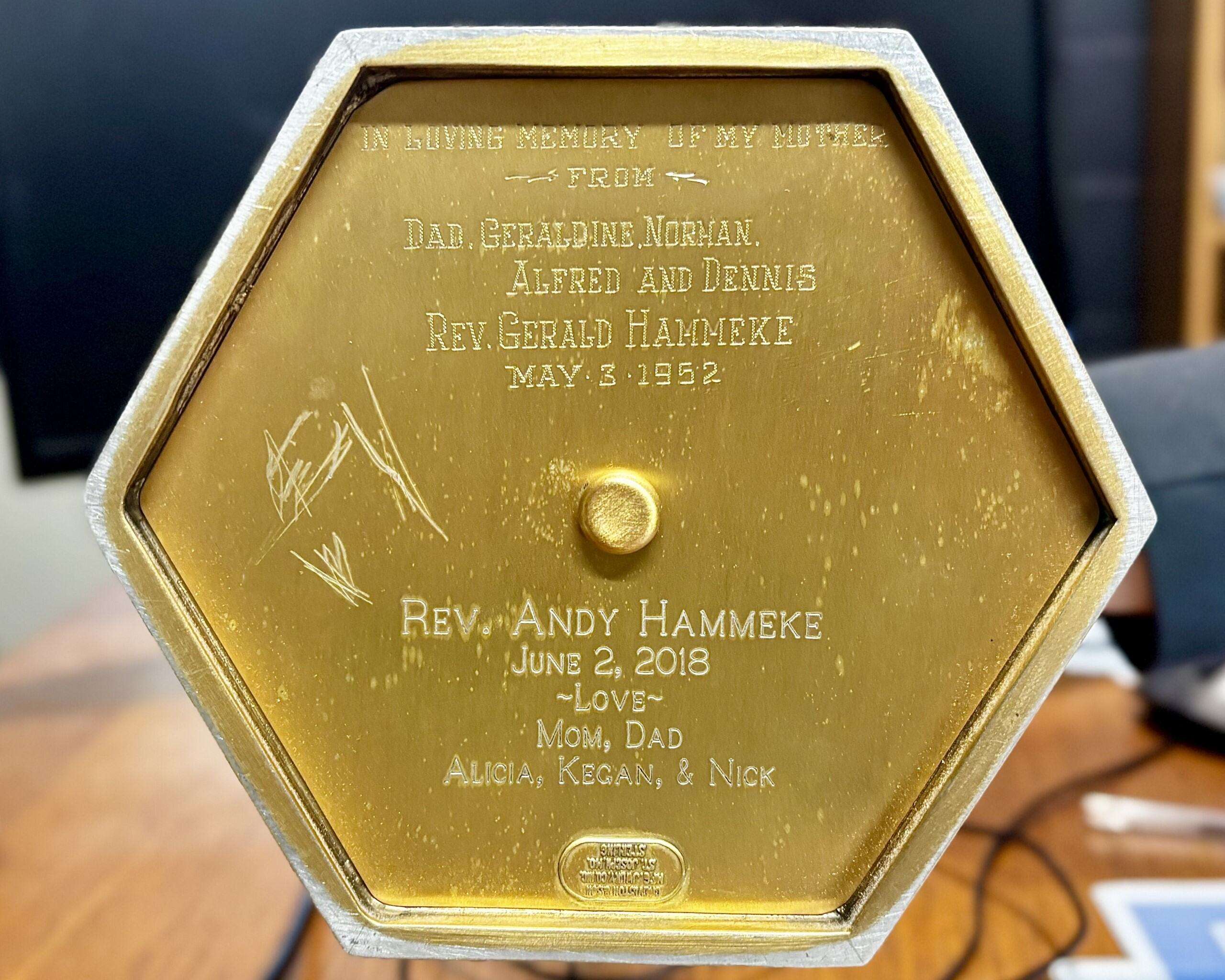 The bottom of the chalice has engravings of several of The Rev. Andy Hammeke's family. These include his sister Alicia Hammeke, Nick Hammeke and his brother-in-law, Kegan. Photo by Tony Guerrero/Hays Post