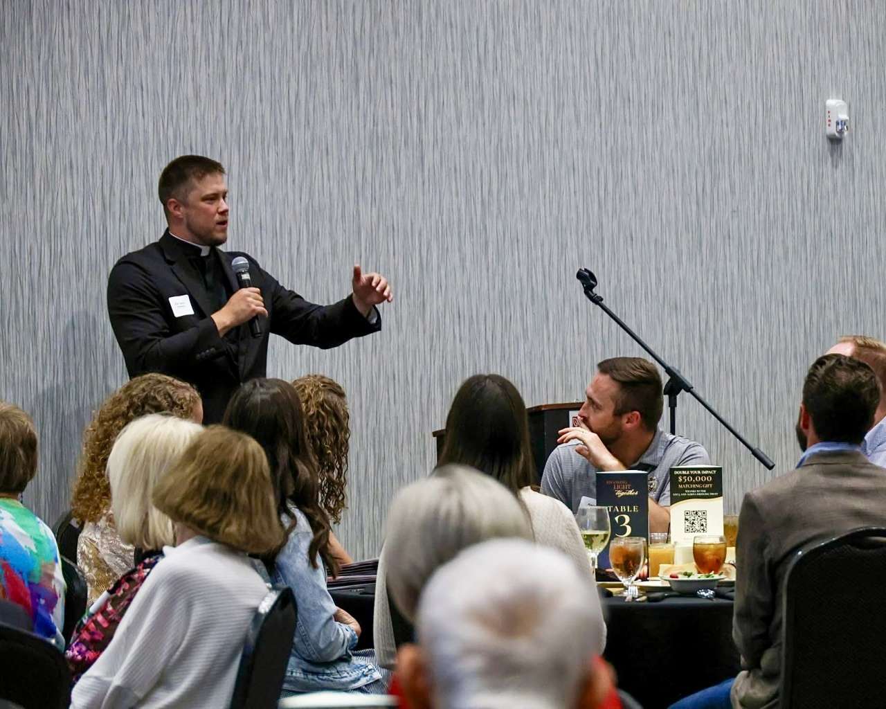 The Rev. Andy Hammeke speaking at the 2026 Becoming Light Together dinner and fundraiser. The event is an evening to "celebrate the good work Christ is doing in the hearts of Fort Hays Catholic students." Courtesy photo