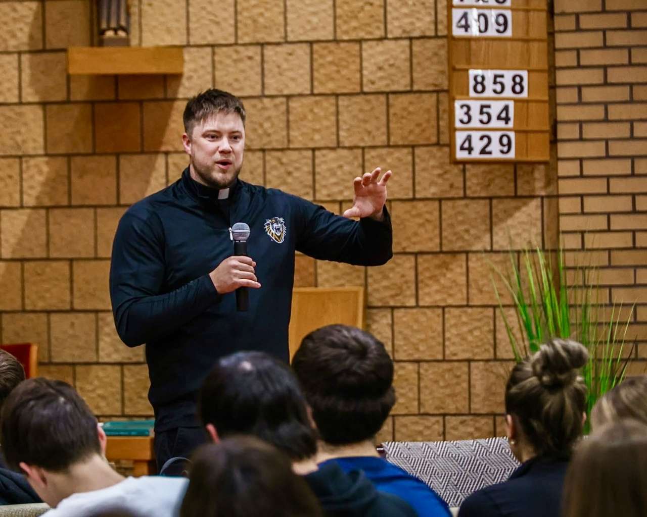 The Rev. Andy Hammeke speaking to the Fort Hays State University Catholic Tigers. Courtesy photo