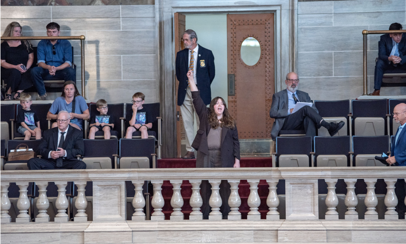 Melana Salisbury is among a small protest that breaks out in the Missouri House gallery as the House passed a “Born-Alive Abortion Survivors Protection Act,” bill Wednesday (Anna Spoerre/Missouri Independent).