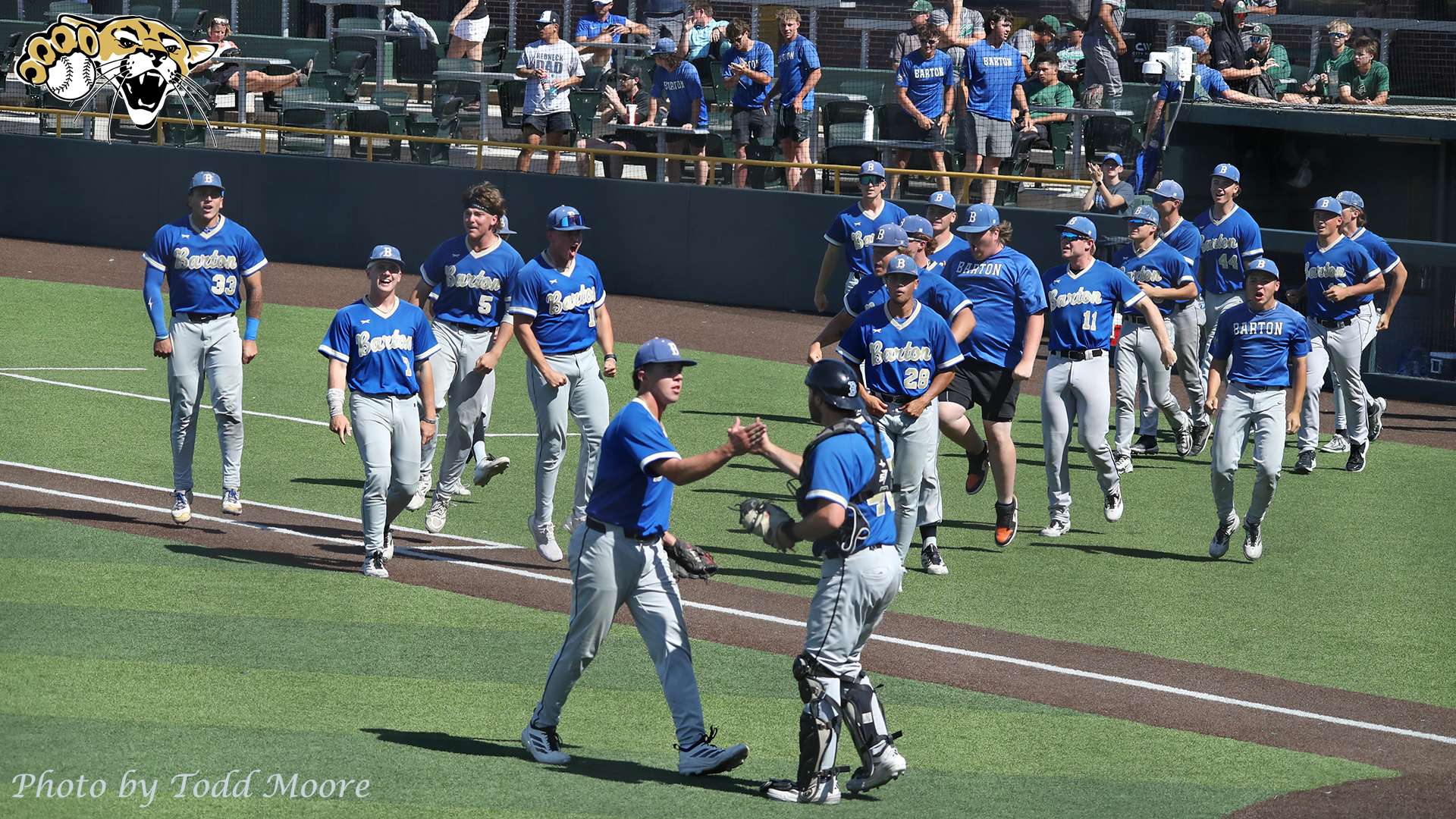 &nbsp;Trey Mackwood and Dalton Jorgensen shake hands as Cougars celebrate the last out (Photo Todd Moore Barton Sports Information)