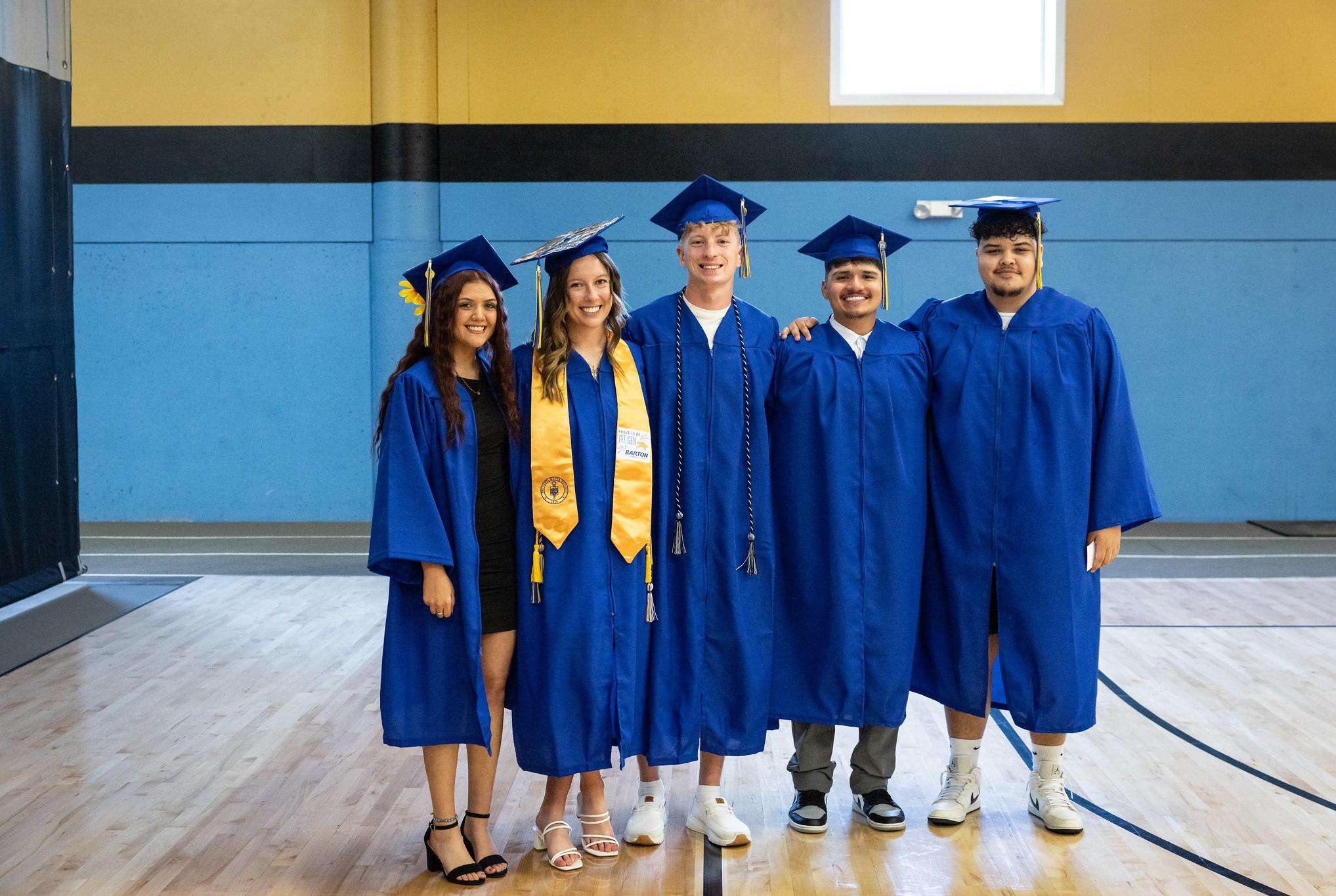 Students pause for a photo before the 2025 commencement ceremony in the Barton Gym. (photo by Barton Communications)