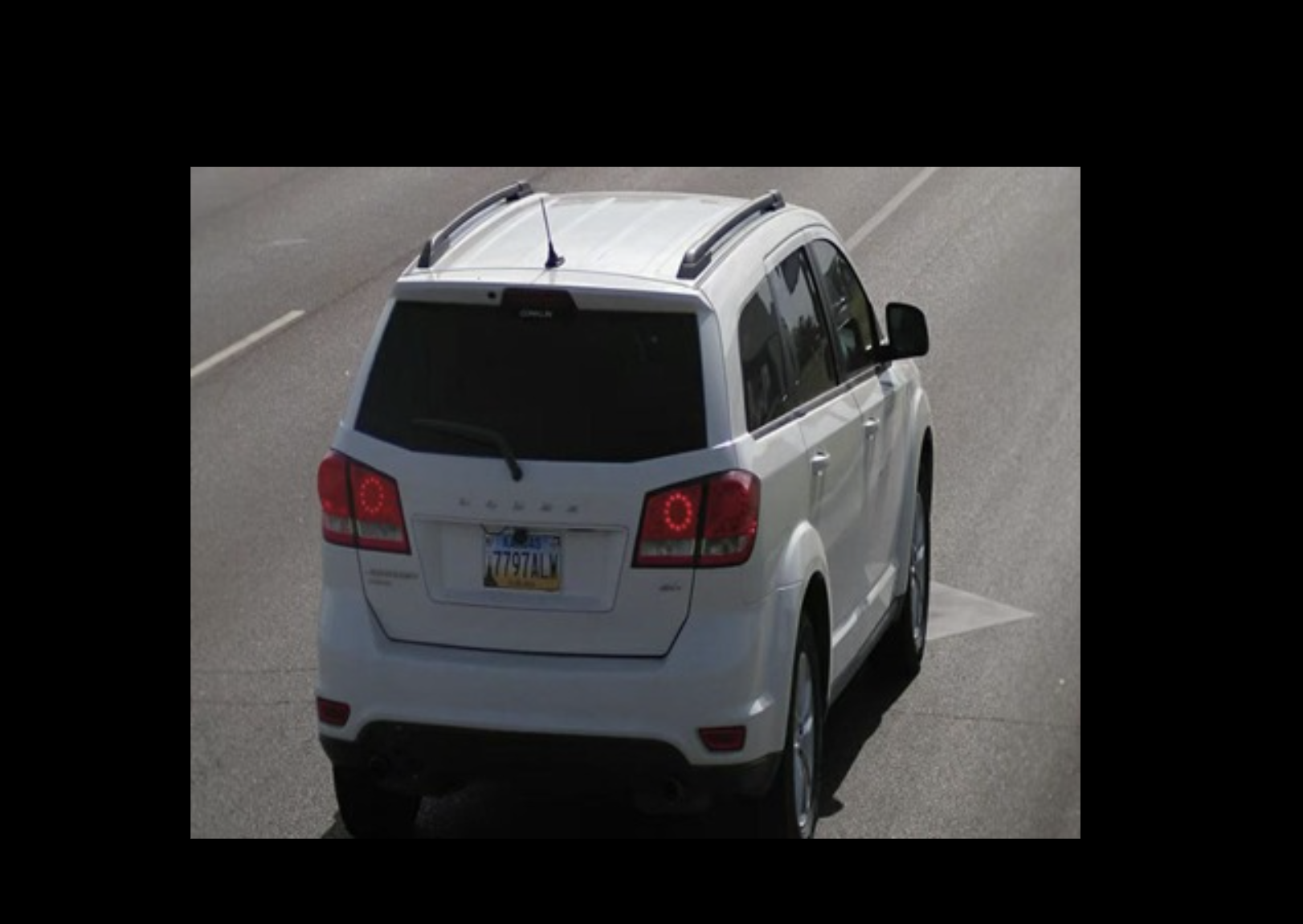 2014 Dodge Journey bearing Kansas tag 7797ALW.