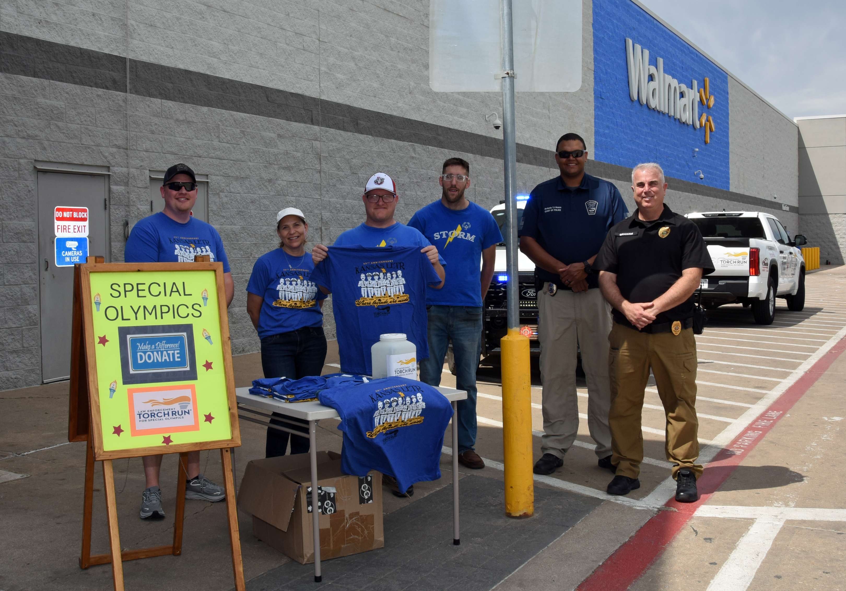 Larned Law Enforcement and Special Olympics representatives join forces on Friday in front of Great Bend Walmart to promote the upcoming Law Enforcement Torch Run. Left to right are Jake LaMunyon (SOKS director of development for LETR), Kathy Graham (LSCF), Josh Trimmer and Austin Levingston (Storm Team athletes), Antonio “TJ” Hearn (Interim Chief of Police, Larned), and Jim Graham (LSCF).