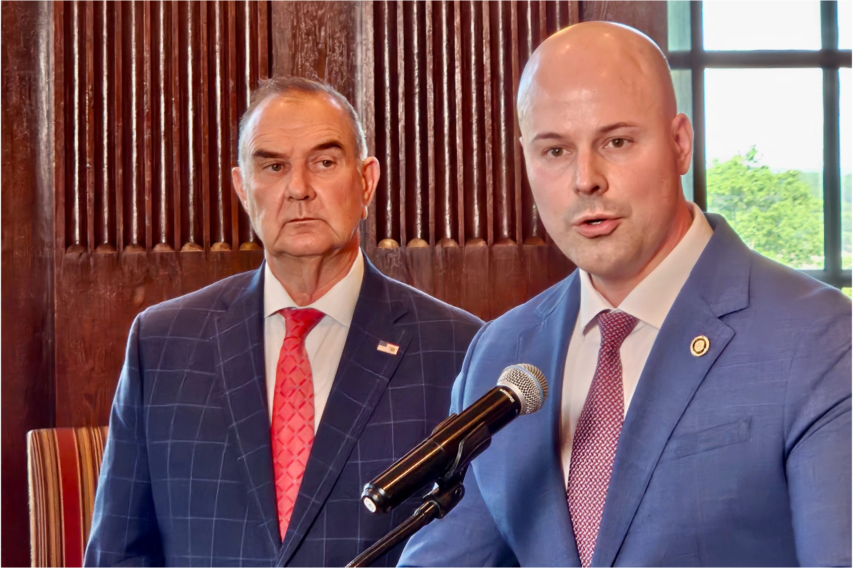 Missouri Senate Majority Leader Tony Luetkemeyer, a Republican from Parkville, speaks at a news conference Thursday as Gov. Mike Kehoe watches (Rudi Keller/Missouri Independent).