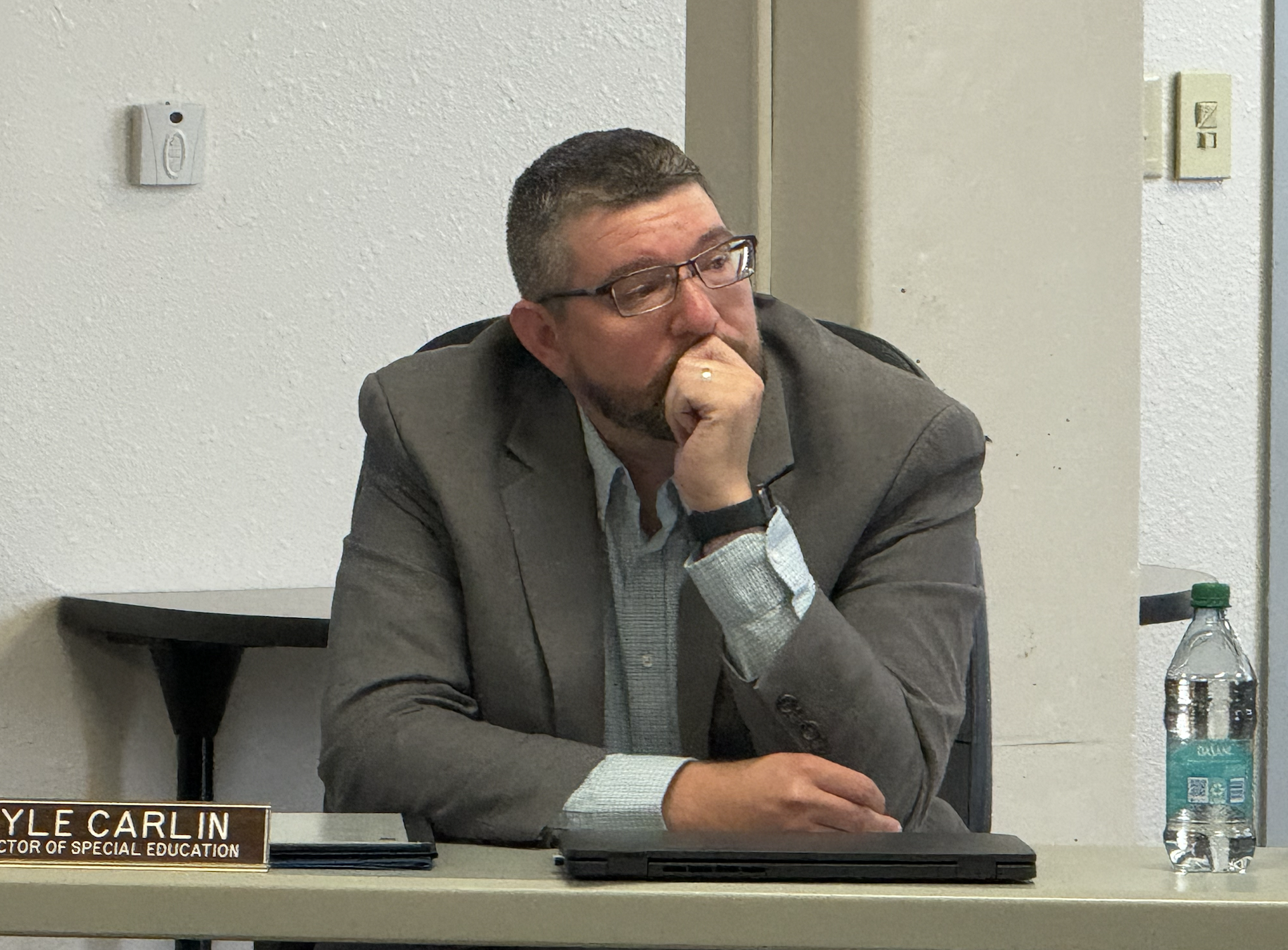 Kyle Carlin, outgoing&nbsp;West Central Kansas Special Education Co-op director, was honored by co-op school psychologists, including Julie Zollinger, at the May 12 Hays USD 489 school board meeting.&nbsp;Photo by Cristina Janney/Hays Post