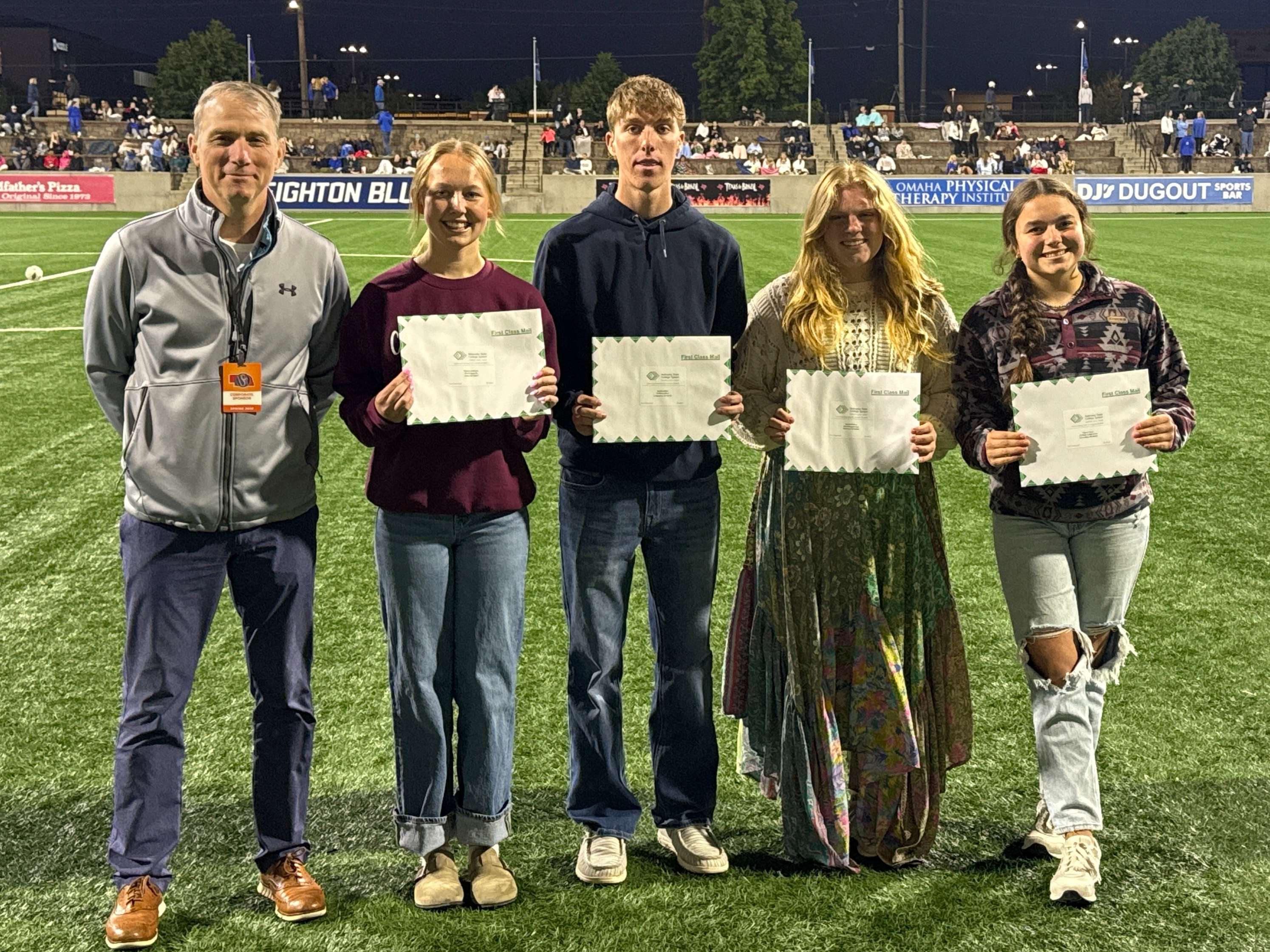 Scholarship recipients at State Soccer. Left to Right: Chancellor Paul Turman, Karsyn Lemburg, Jacob Lofton, Naomi Gahan and Peyton Huey.
