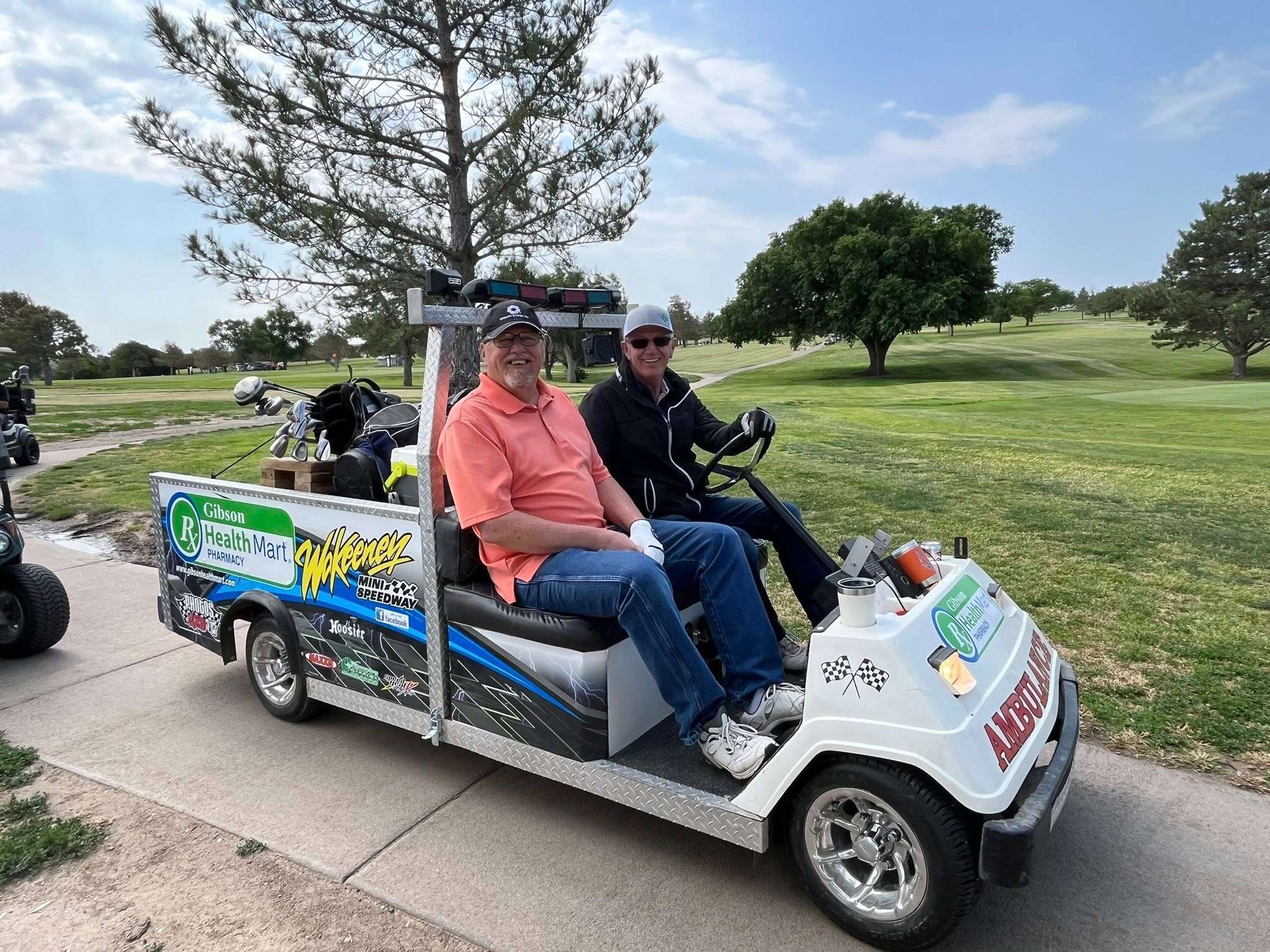 Two players on a gold cart at the 2025 Ellis High School Alumni golf tournament. Courtesy photo