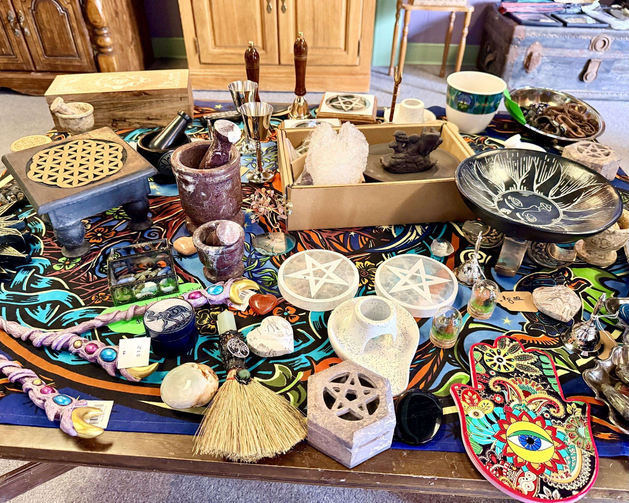 A table covered in miscellaneous and spiritual items at Alternative Reflection. Photo by Tony Guerrero/Hays Post
