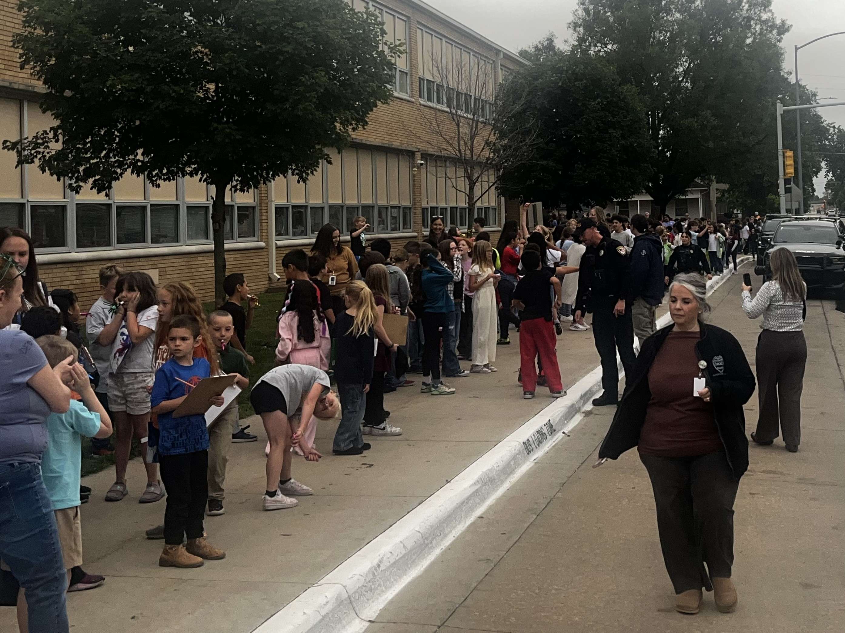Students and staff wait outside of Allen Stem Magnet School to welcome home fellow students who won the Kid Win World Challenge in Madison, Wisconsin.(Hutch Post photo / Mare Jacobs)