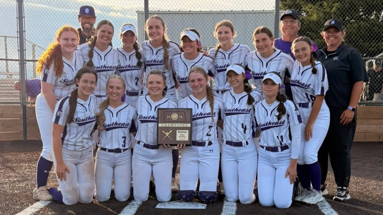 The Lady Trojans proudly display their regional trophy after taking down Wichita Trinity in the regional championship.