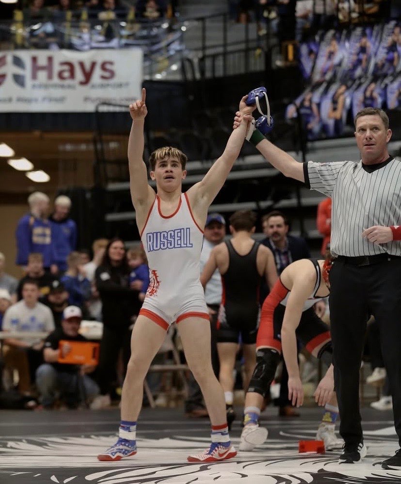 Xzephren Donner getting his hand raised as he wins a wrestling match. Photo submitted