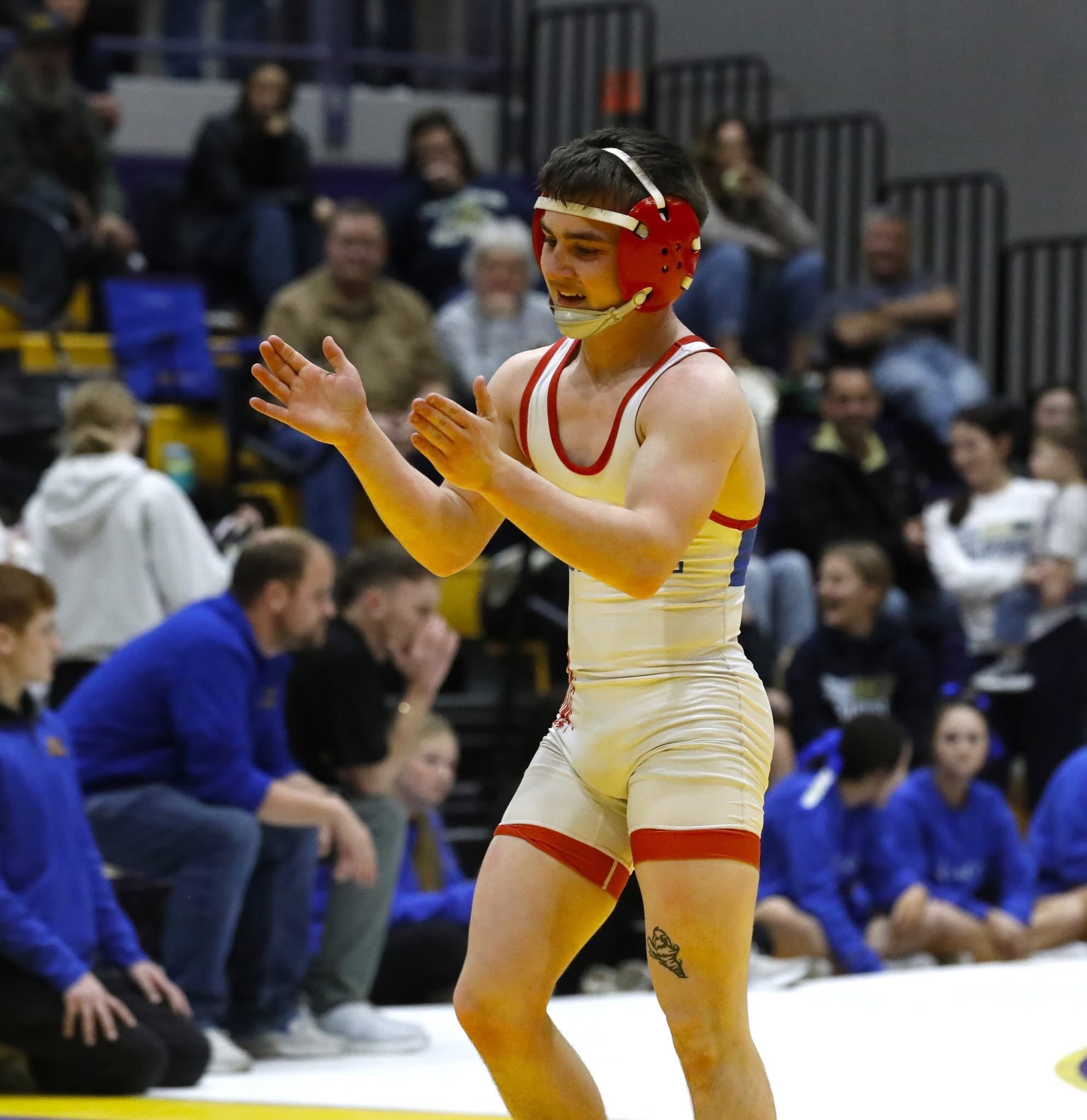 Xzander Donner clapping his hands after defeating an opposing wrestler during a match. Submitted photo