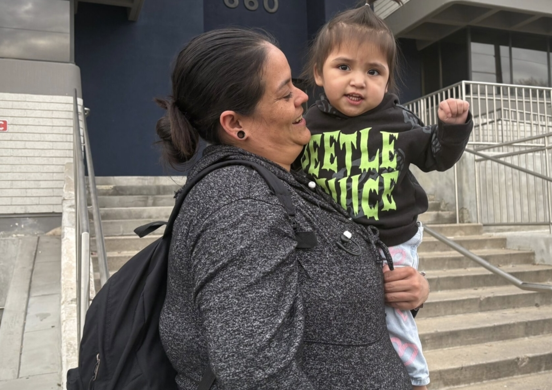 Carmen Cancino and her daughter Ximena Lopez at a December protest against arrests of immigrants at green card appointments in Salt Lake City. The Trump administration is threatening to force legal immigrants applying for green cards to return home first and wait for processing. (Photo by Annie Knox, Utah News Dispatch)