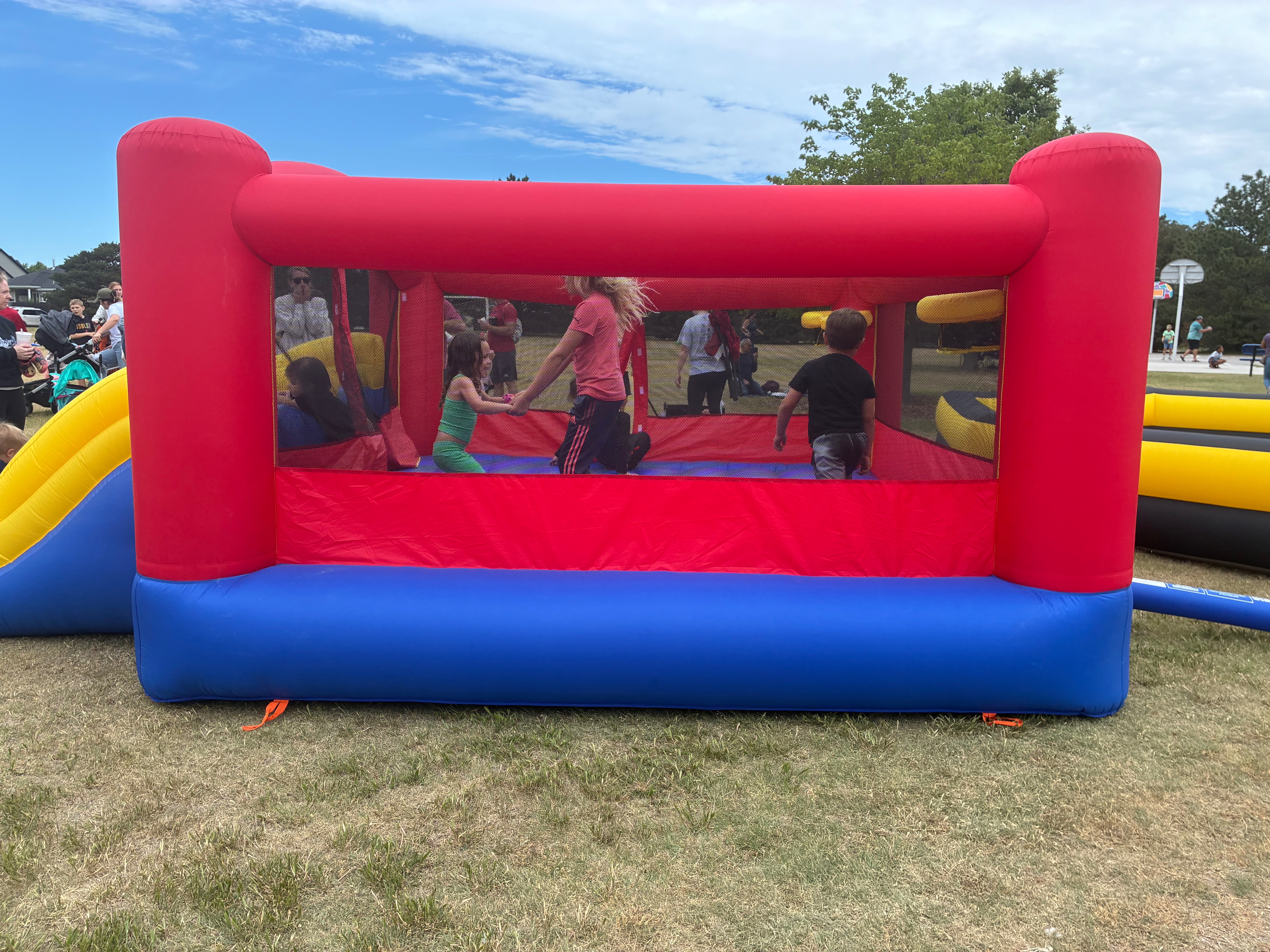 Children enjoy one of the inflatable bouncy houses. Photo by Alin Hett/ Hays Post<br>