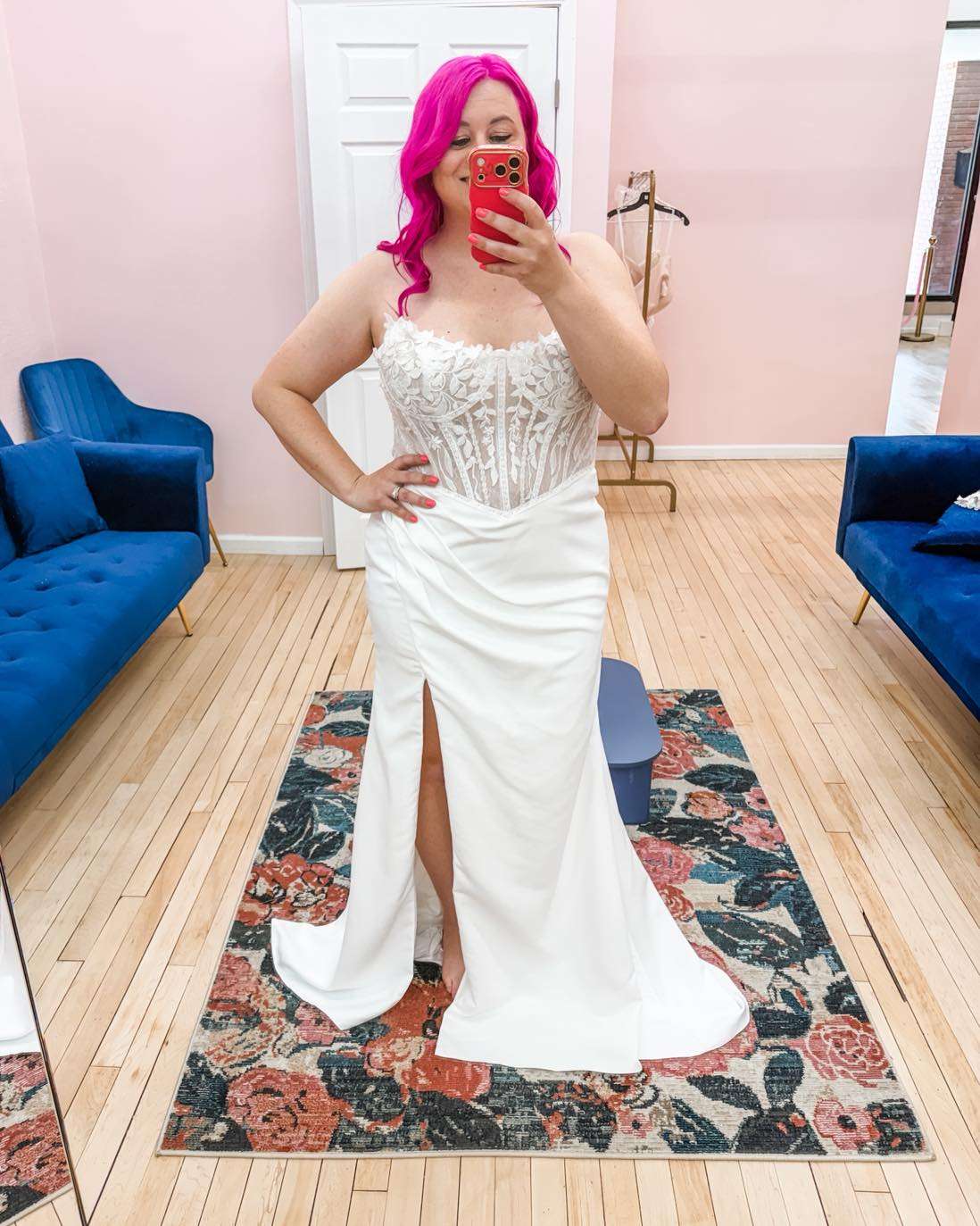 Kayla Rathbun, owner of Something Blue, modeling in a dress in one of the store's bridal suites changing rooms. Courtesy photo