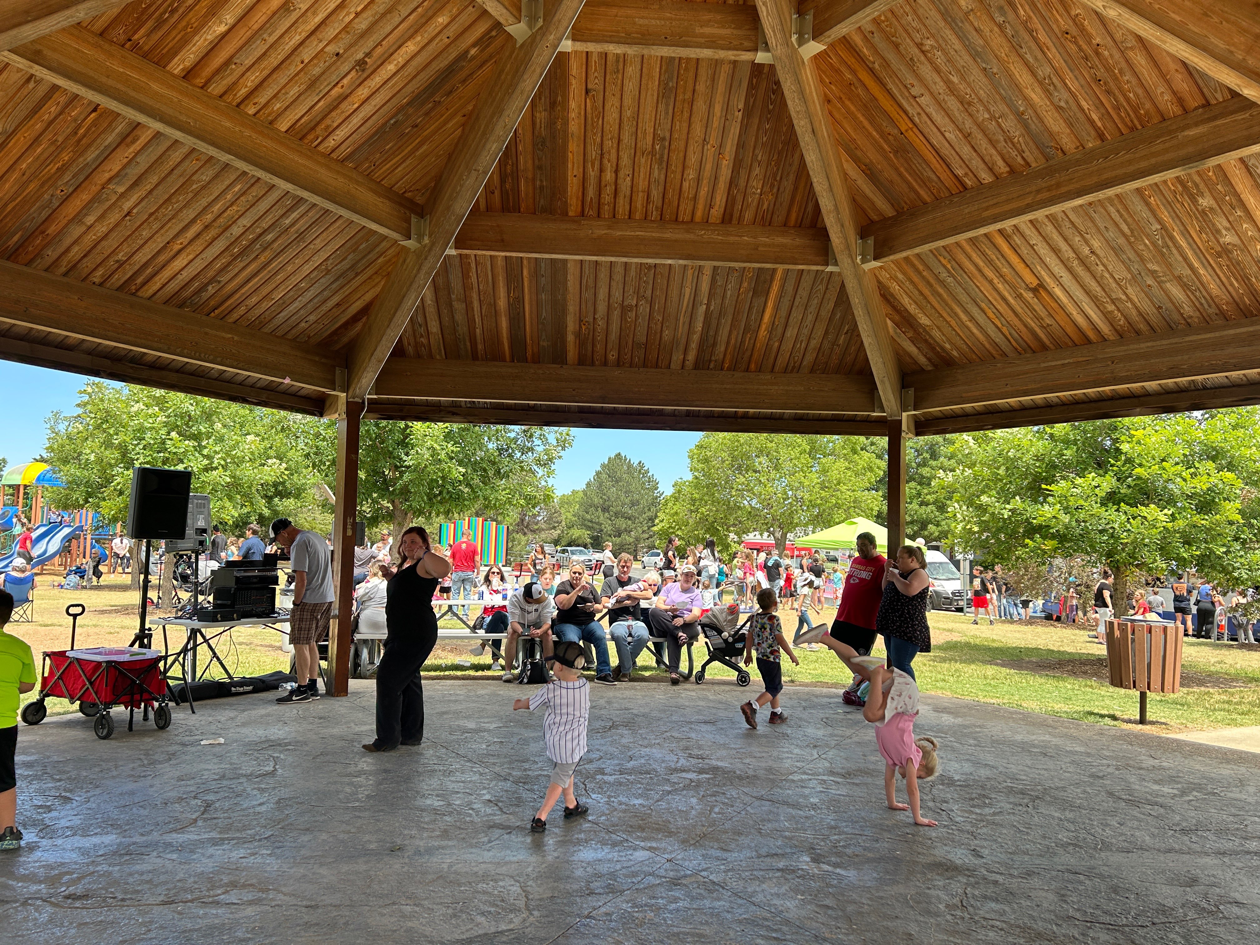 Families dance under the pavilion and enjoy the ARC Park festivities. Photo courtesy of Hays CVB. 