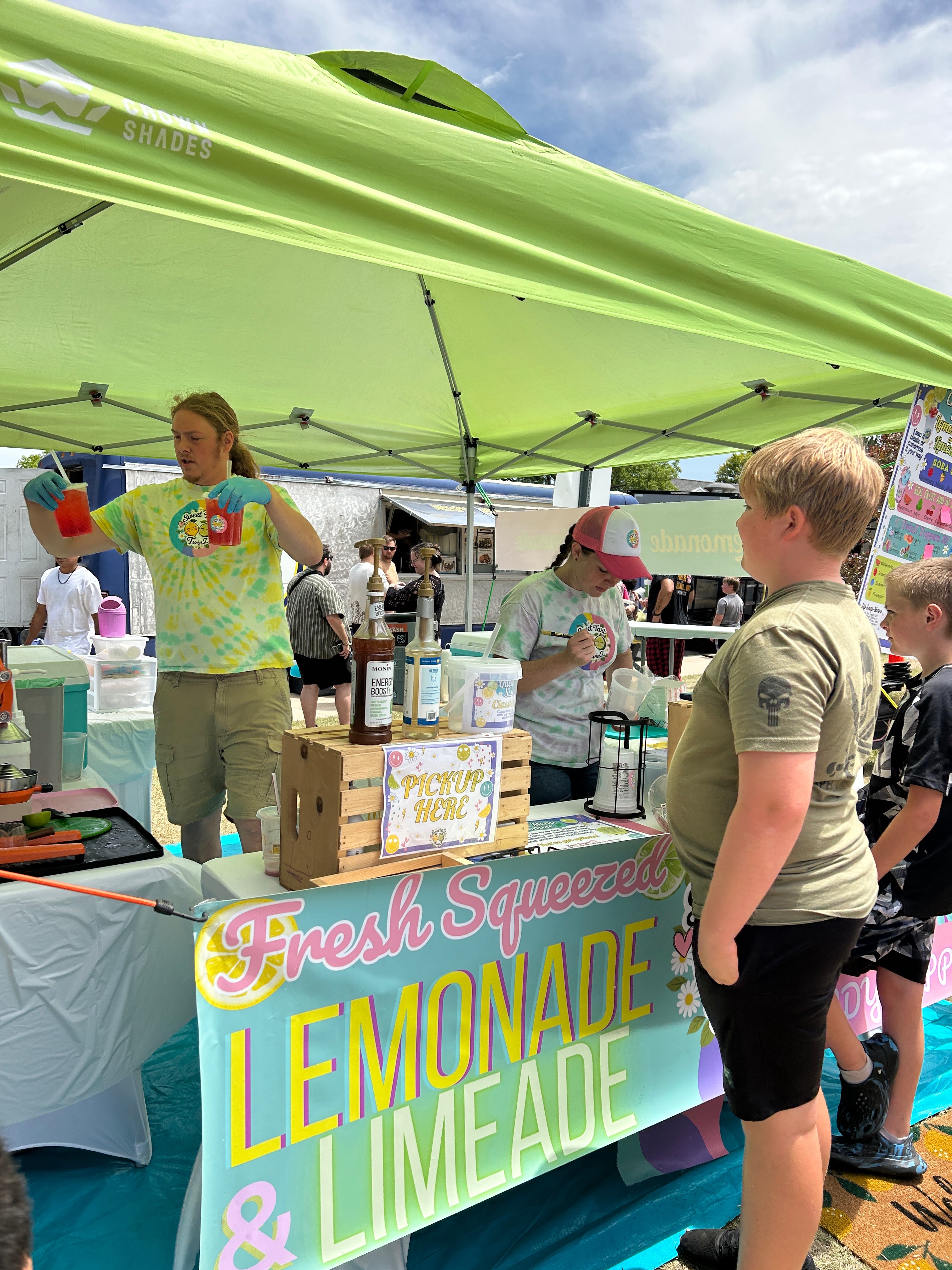 Kids lineup to drink some freshly squeezed lemonade during the hot day. Photo courtesy of Hays CVB.