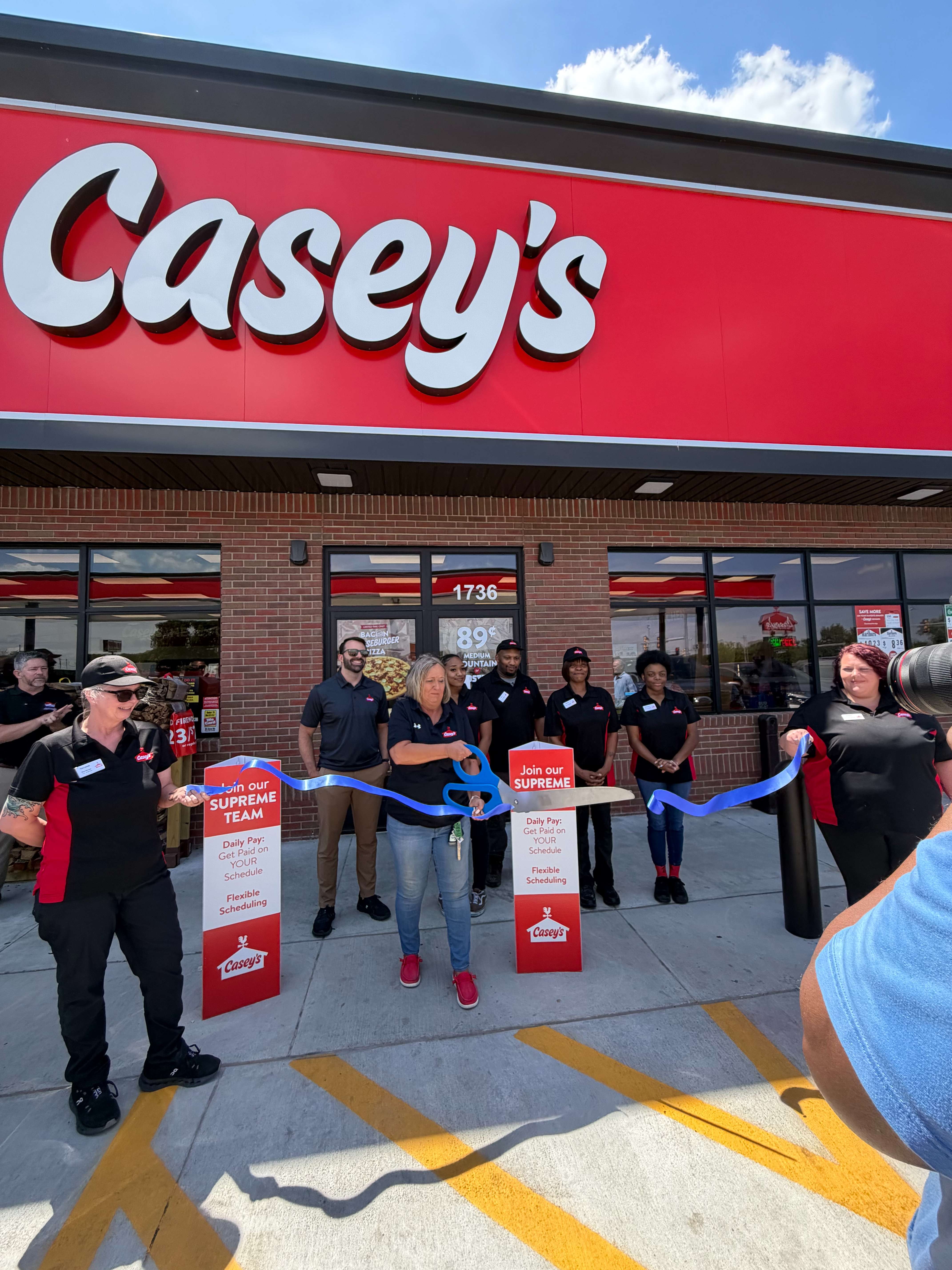 Ann Mitchell, District Manager of Casey's General Store cuts the ribbon to officially open their new location at 1736 N. Washington St. in Junction City.