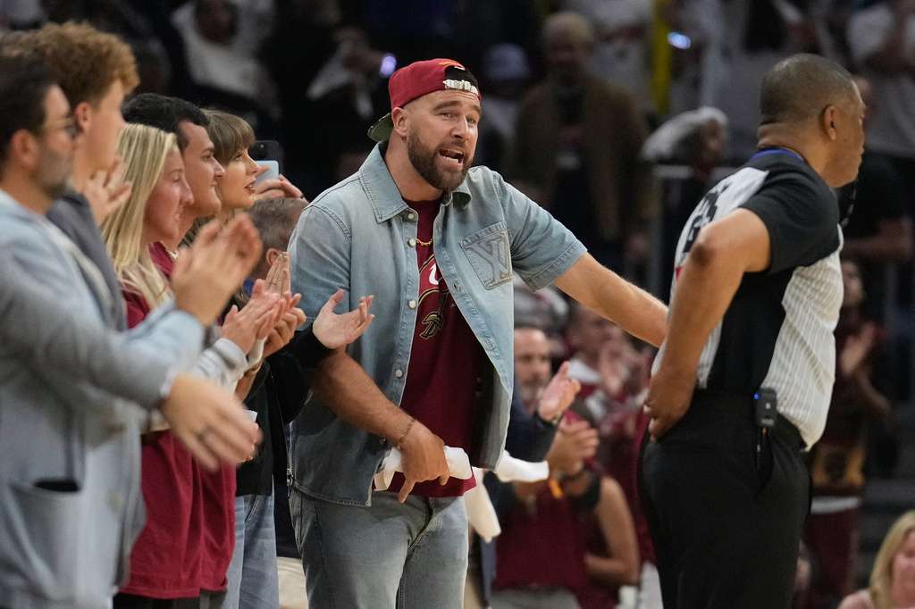 Travis Kelce reacts during the second half of Game 3 in the Eastern Conference finals NBA basketball playoffs series between the New York Knicks and the Cleveland Cavaliers in Cleveland, Saturday, May 23, 2026. (AP Photo/Sue Ogrocki)