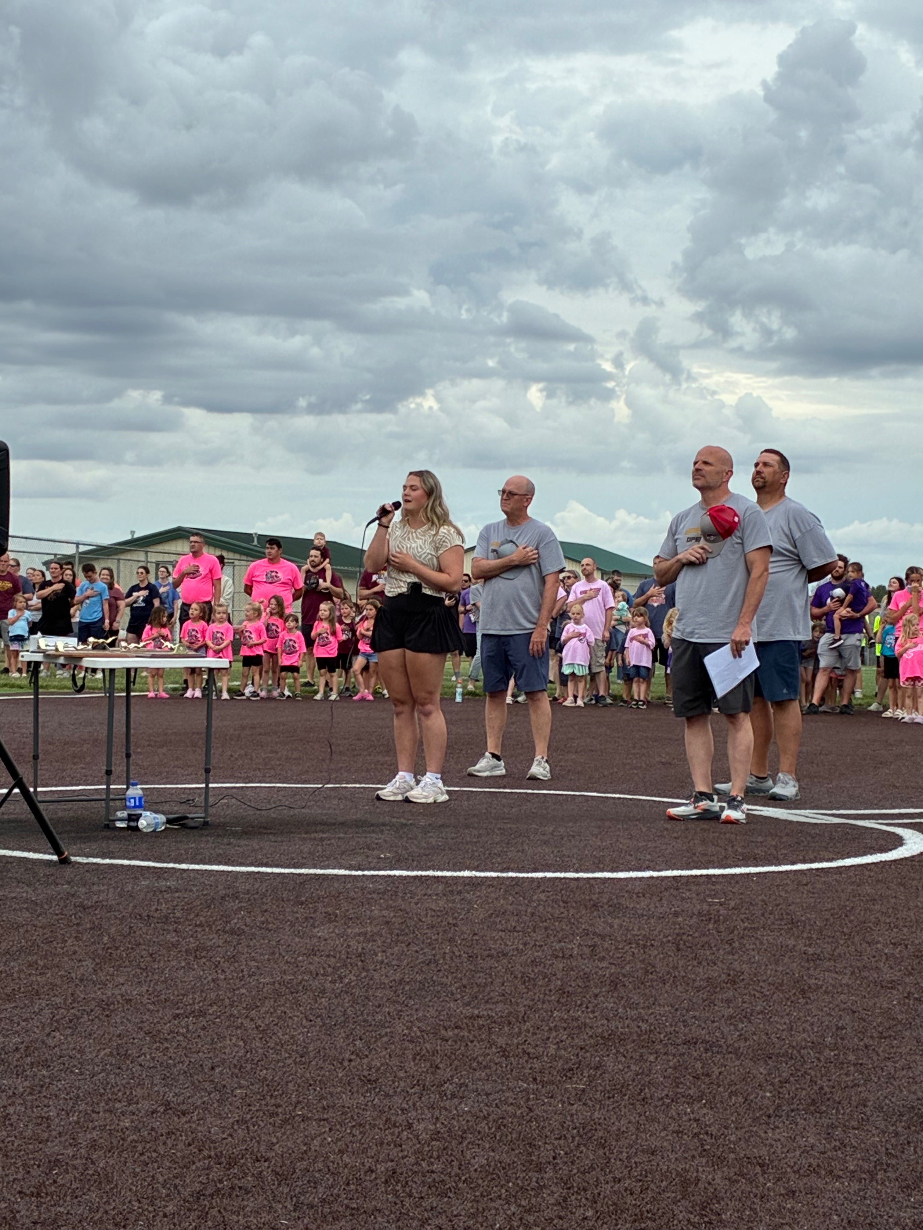 Myah Mattheyer performing the national anthem at Hays Rec opening day. Photo by Alin Hett/Hays Post. 