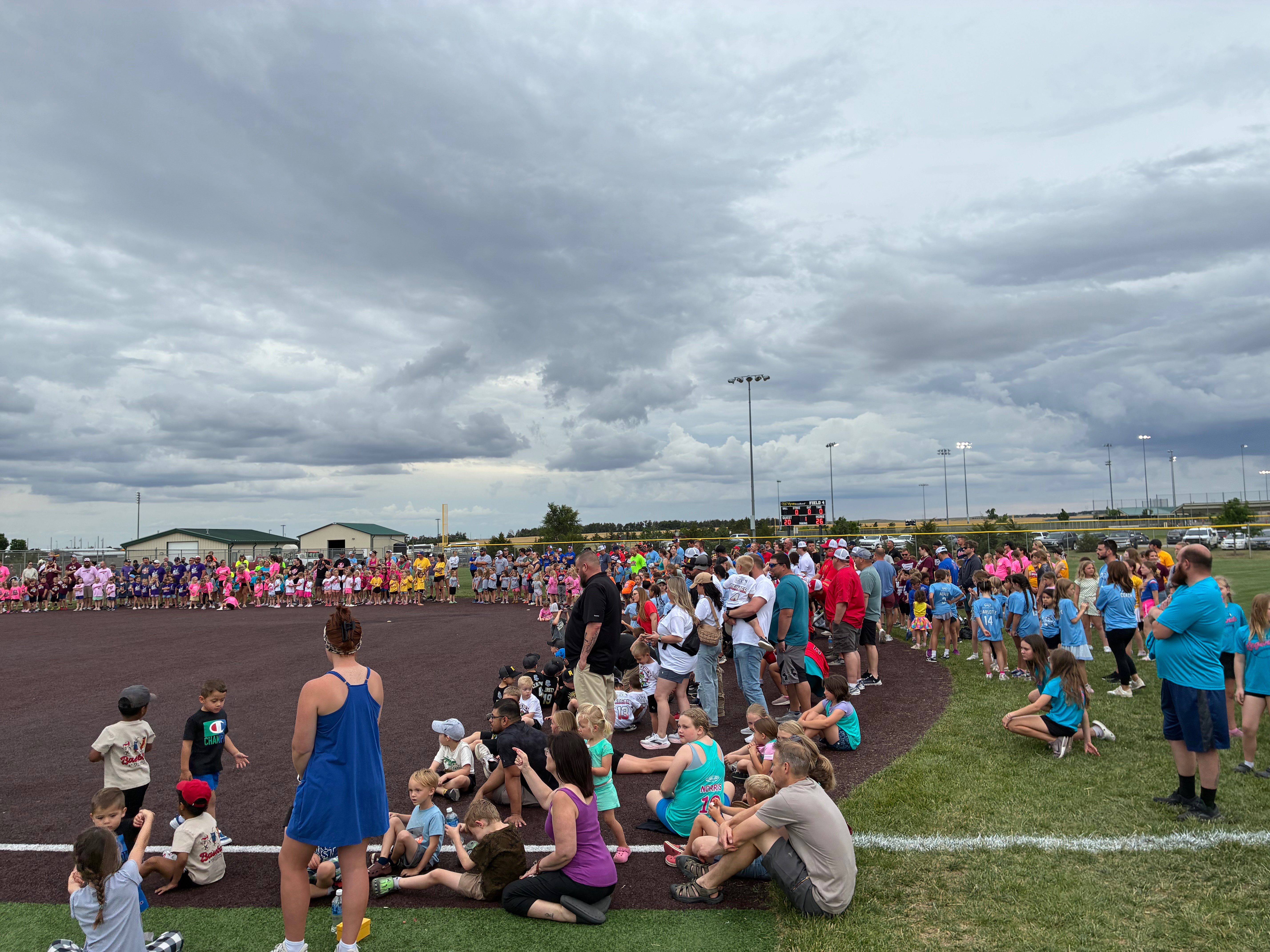 All teams are lined up during Hays Recreation Center Opening Day, 2026. Photo by Alin Hett/Hays Post
