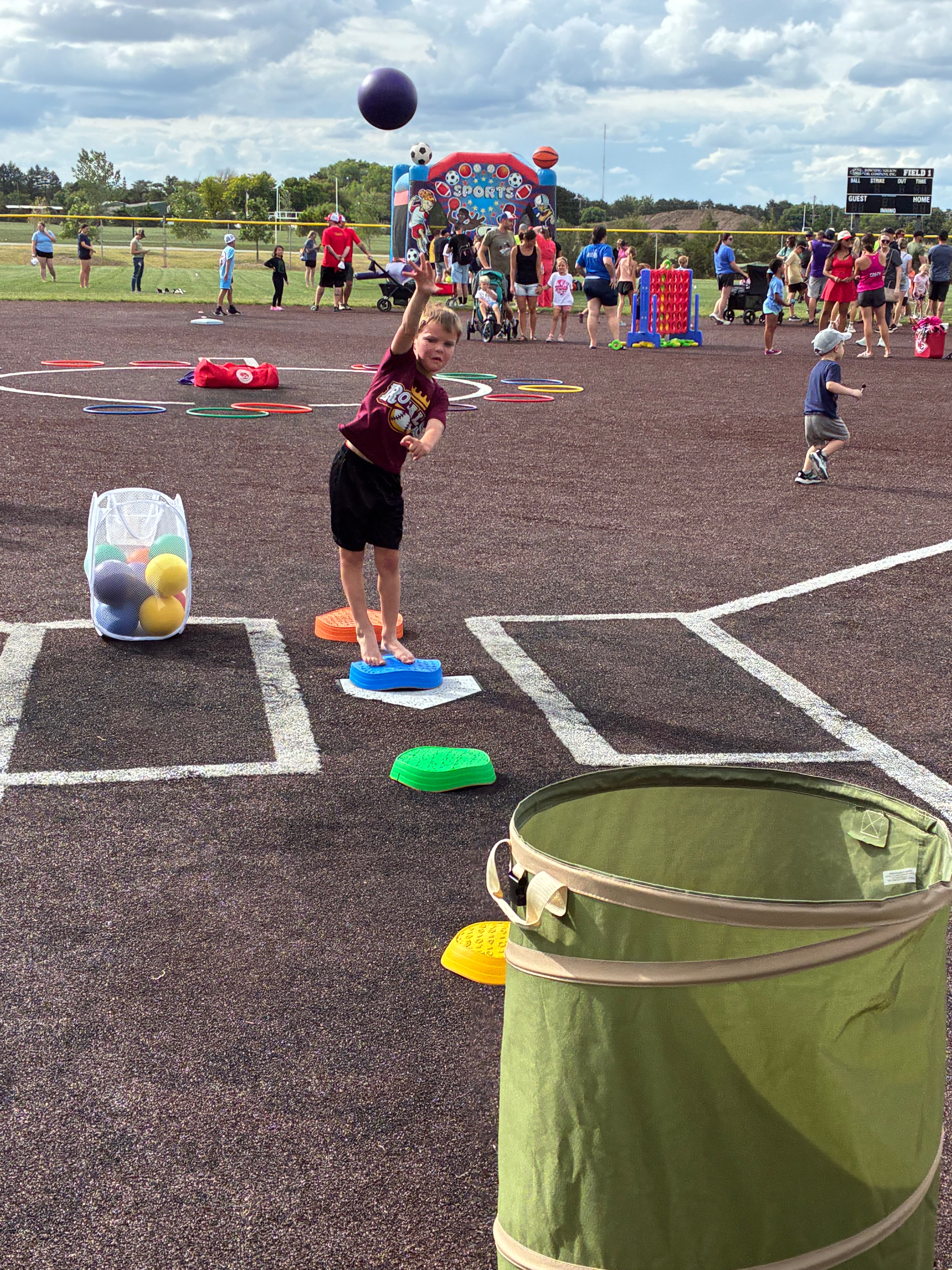 A member from the team The Royals is participating in the ball toss. Photo by Alin Hett/Hays Post. 