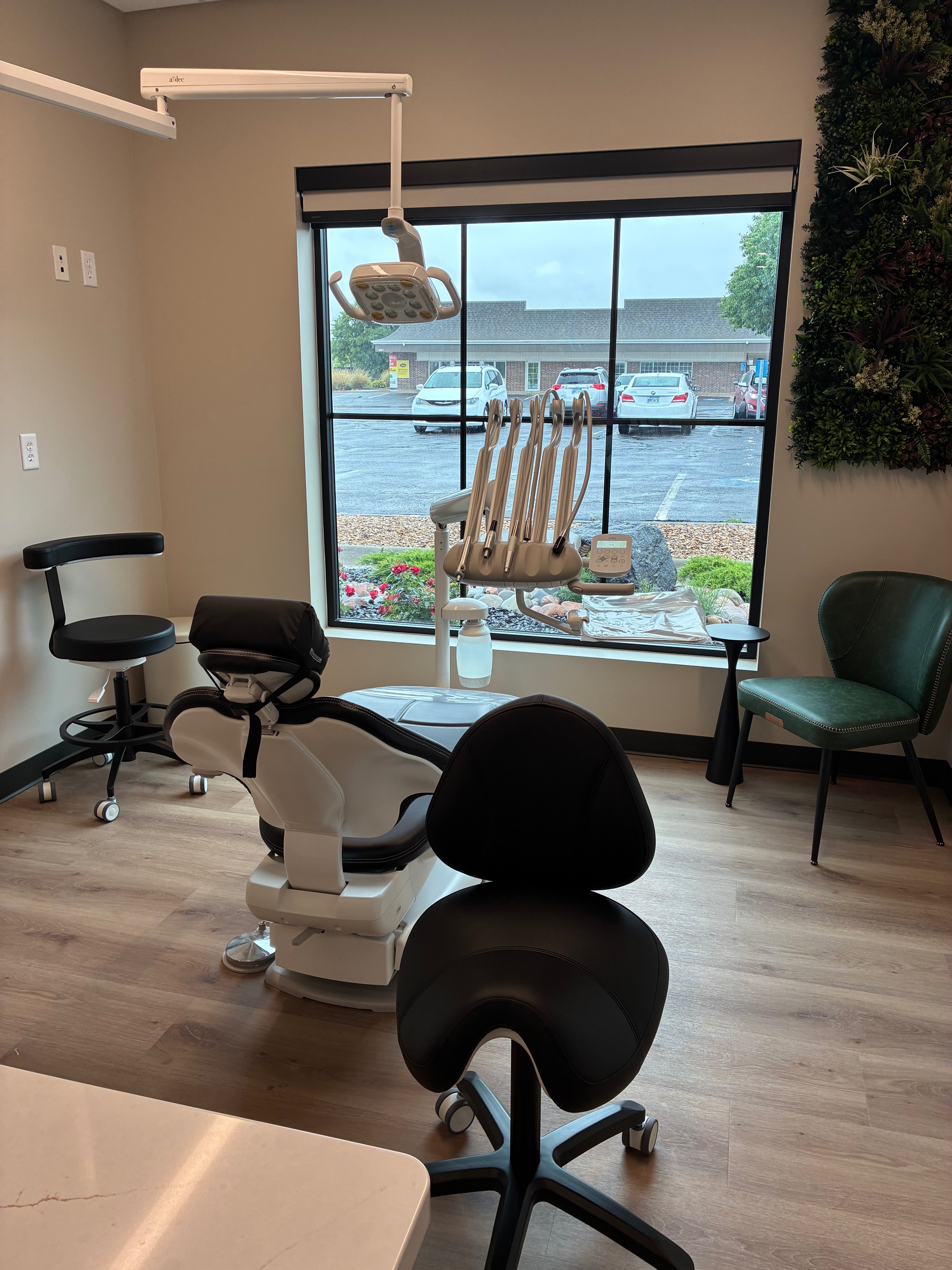 Pictured above is one of several treatment rooms inside Leiker Smiles that feature live greenery walls, part of the office’s nature-inspired design aimed at creating a warm and welcoming environment for patients. Photo by Alin Hett/Hays Post.&nbsp;