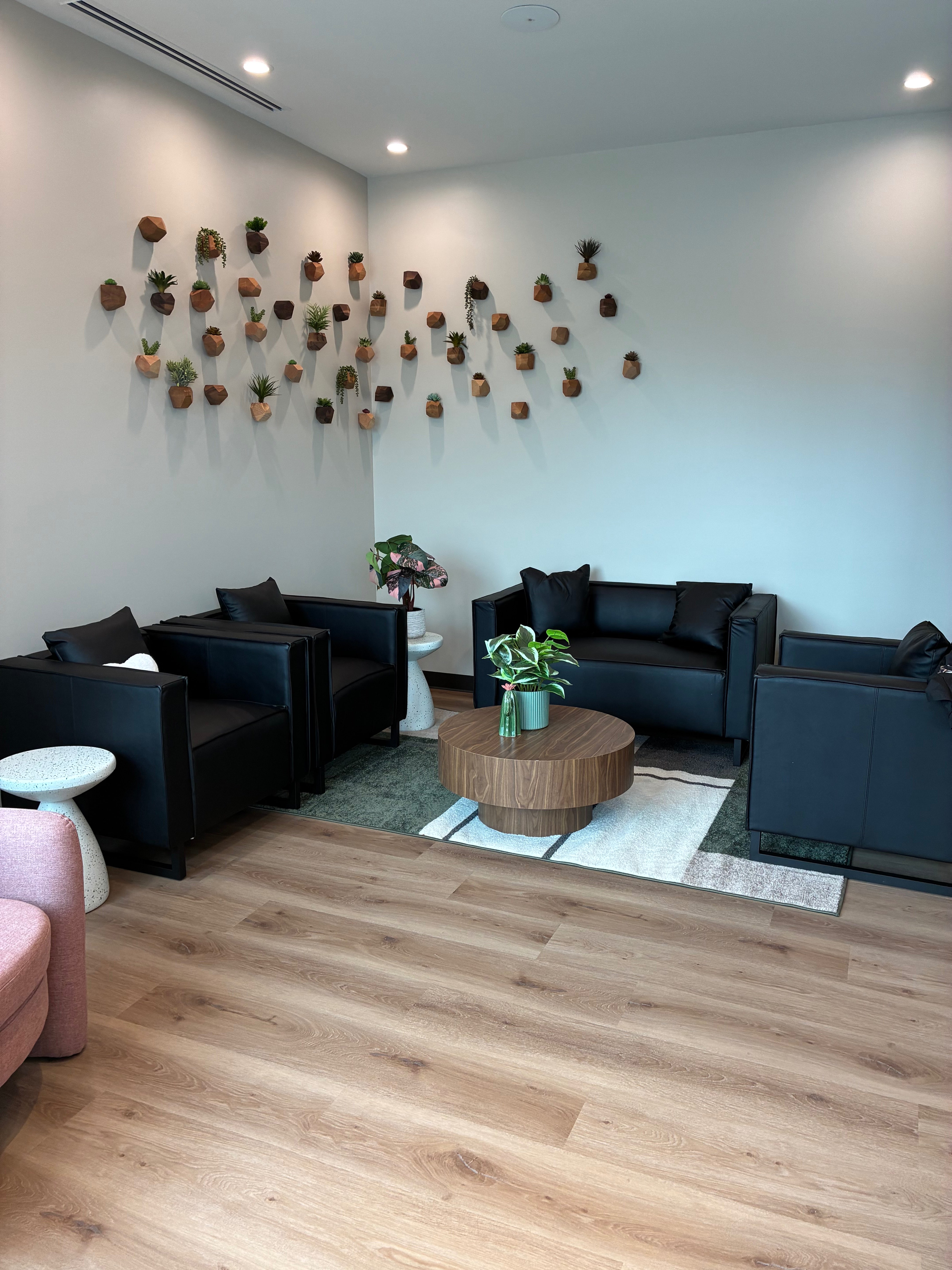The waiting area inside Leiker Smiles features greenery, modern décor and a welcoming atmosphere designed to help patients feel comfortable from the moment they arrive. Photo by Alin Hett/Hays Post.&nbsp;<br>