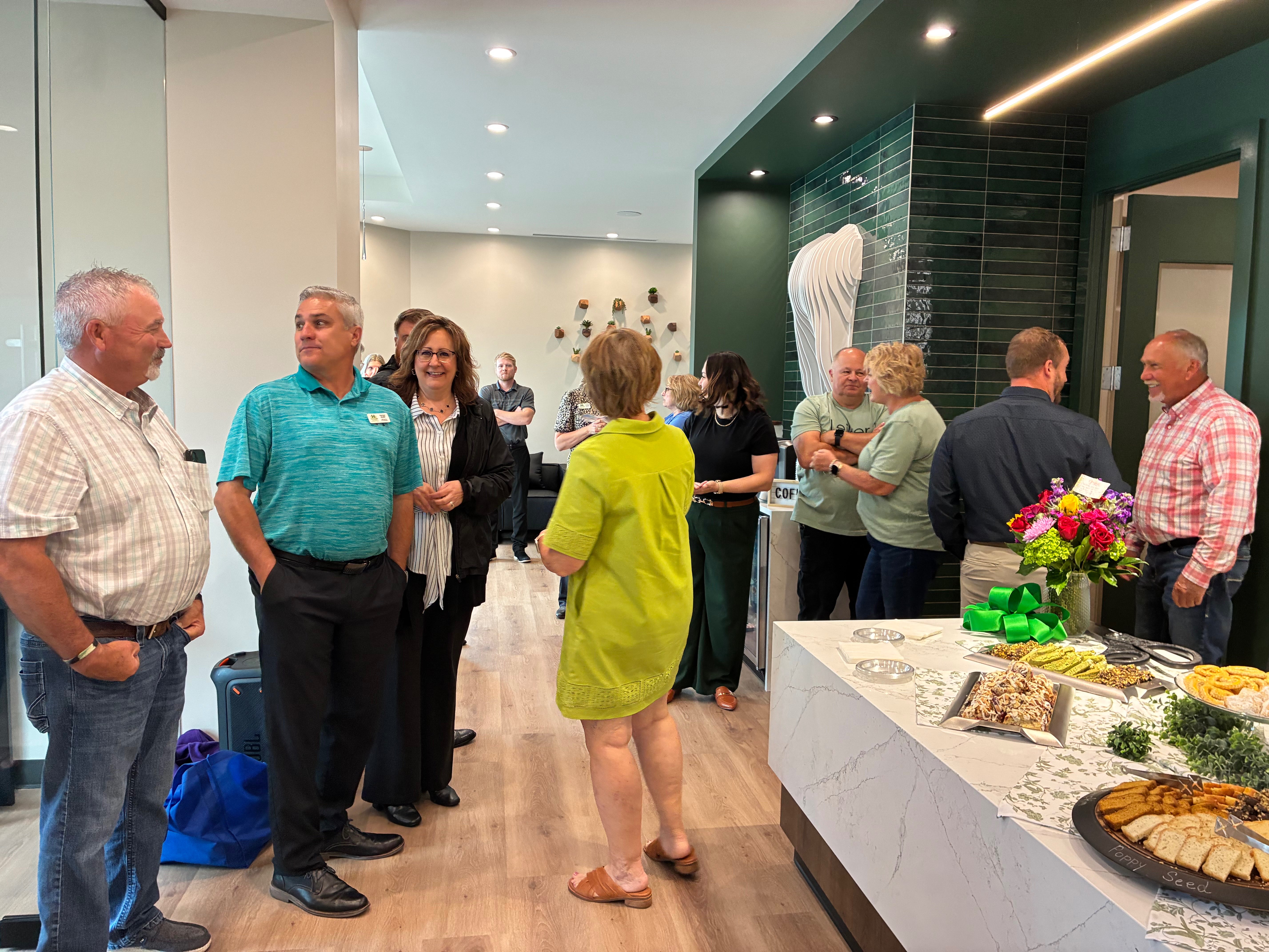 Guests enjoy refreshments and tour the new Leiker Smiles office. Photo by Alin Hett/Hays Post.&nbsp;