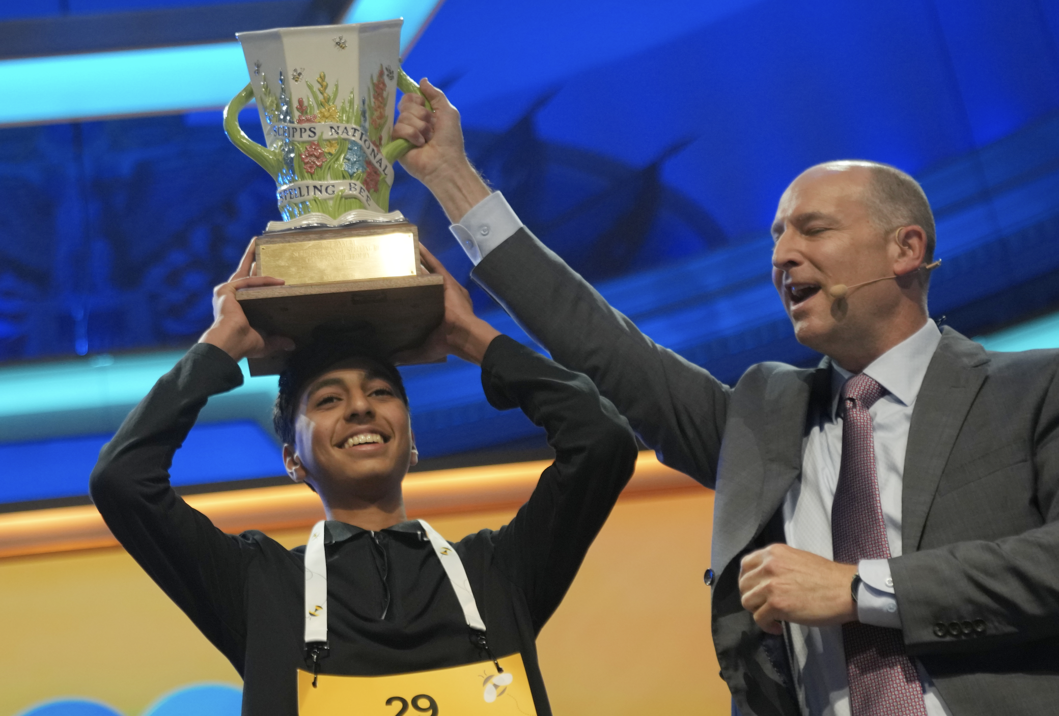 .W. Scripps Company president and CEO Adam Symson, right, holds the trophy over winner of the 2026 Scripps National Spelling Bee, Shrey Parikh, 14, of Rancho Cucamonga, Calif., at DAR Constitution Hall, Thursday, May 28, 2026, in Washington. (AP Photo/Allison Robbert)
