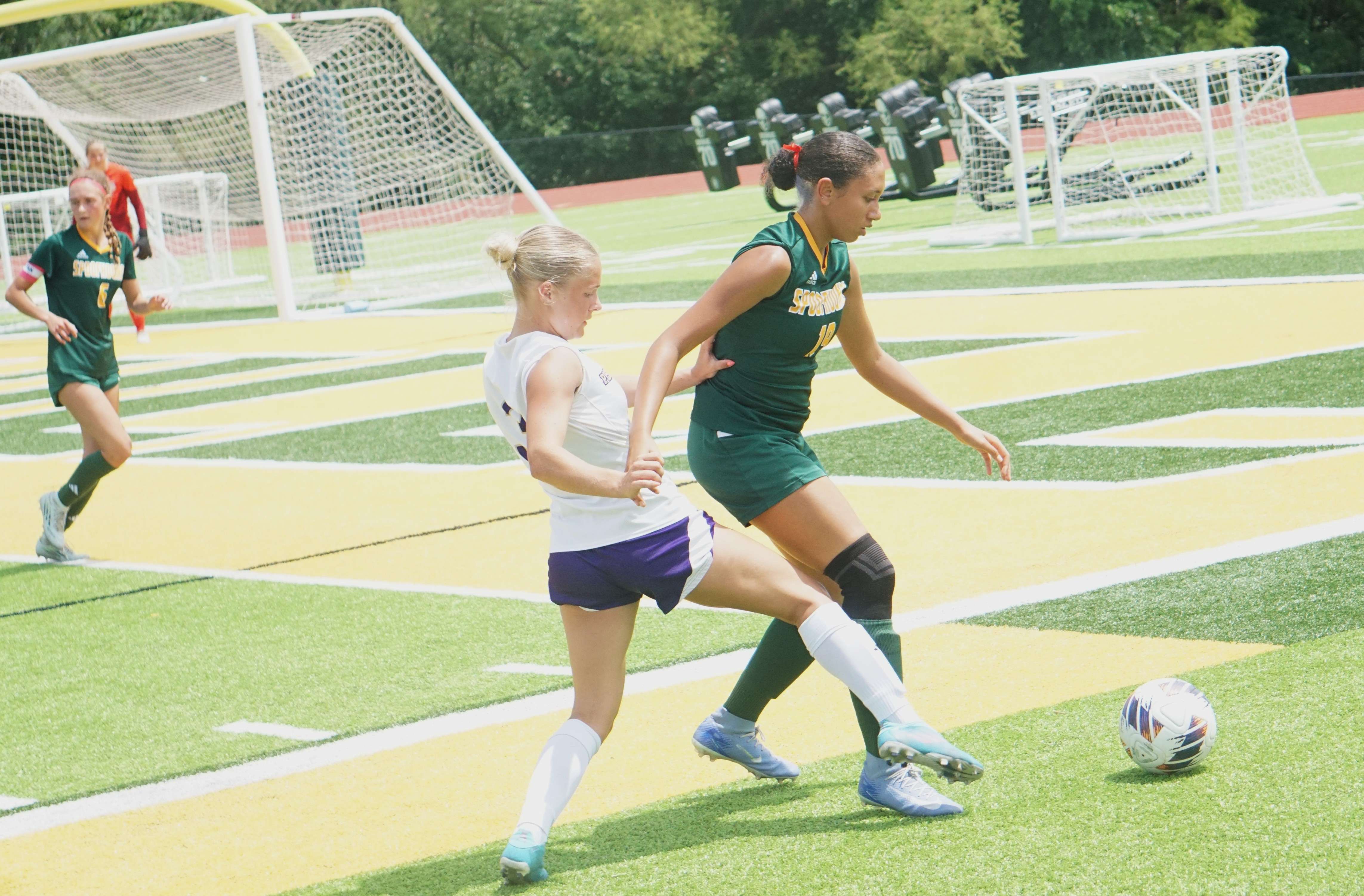 Pleasant Hill's Haley Dimarco (3) attempts to steal the ball from Maryville's Jaidaci Wilmes (19)/ Photo by Matt Pike