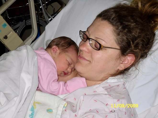 Kaylee Stuart laying in bed with her mother shortly after her birth on Nov. 9, 2009. Courtesy photo.