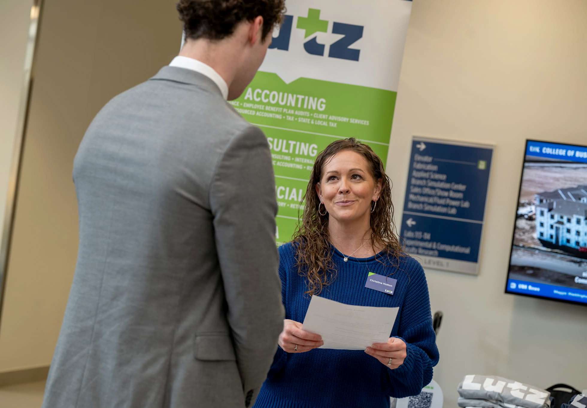 Christina Holton, a corporate recruiter with Lutz, meets with a student during an event hosted by the UNK College of Business and Technology. (Photo by Ryo Suzuki, UNK College of Business and Technology)