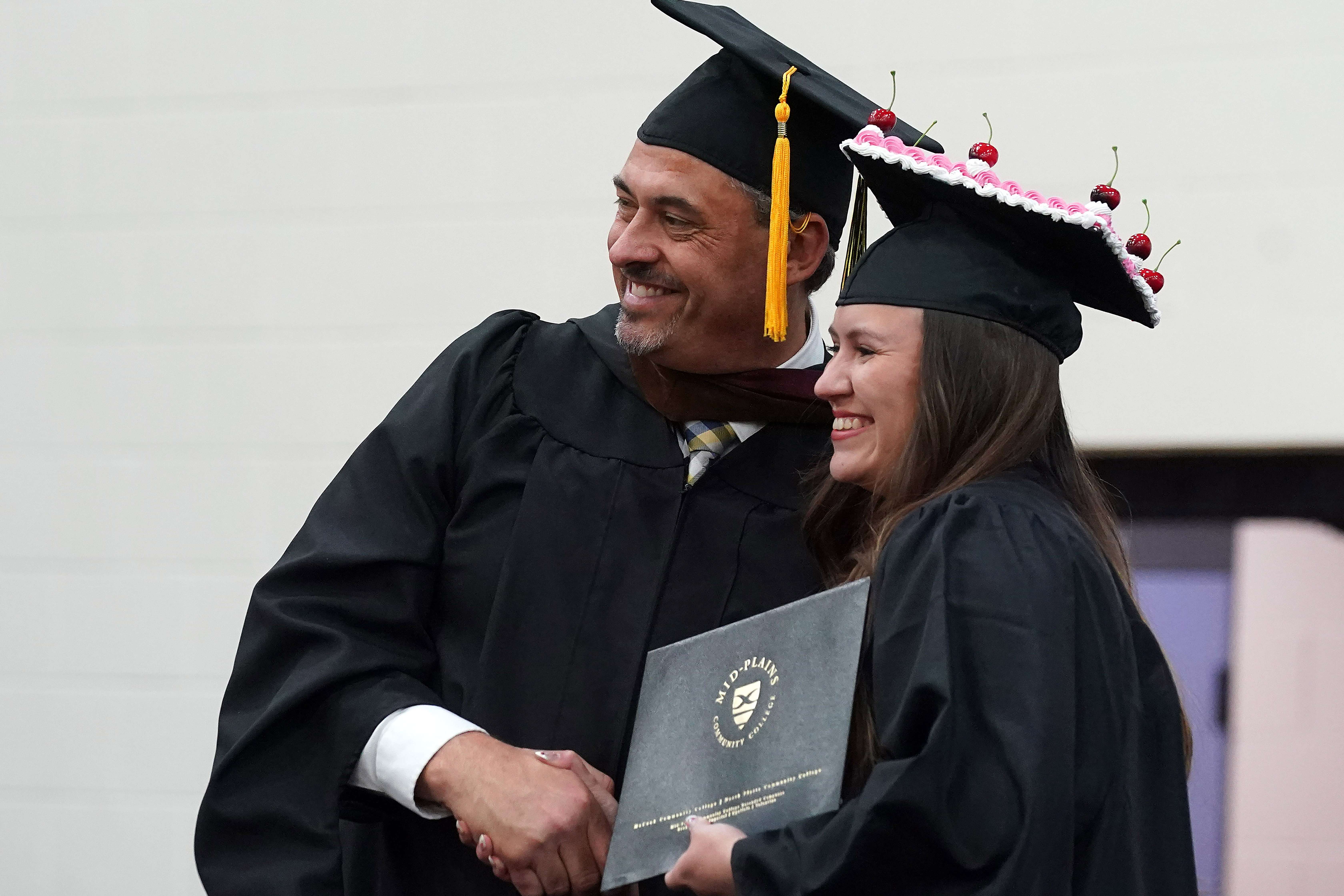 Chloe Bear Killer receives her diploma from MPCC President Ryan Purdy during Commencement at North Platte Community College May 8. (MPCC)