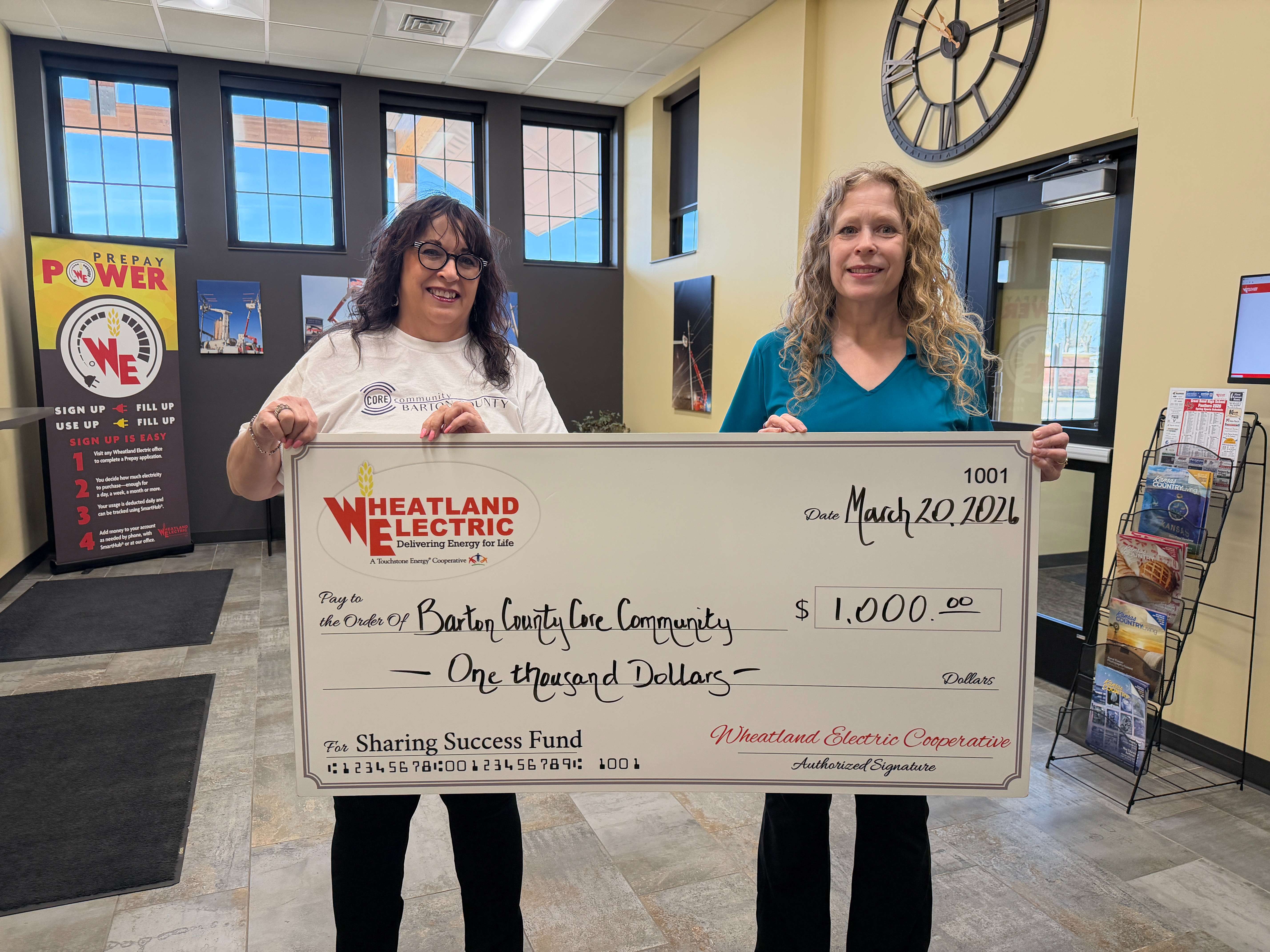 Barton County Core Community, represented by Janice Perez (left), was awarded a Sharing Success grant presented by Mary Hoisington (right), member service and key accounts manager at Wheatland Electric Cooperative. Grant funds will be used to purchase materials, technology and staffing to help ensure the program is able to meet educational outcomes and program objectives